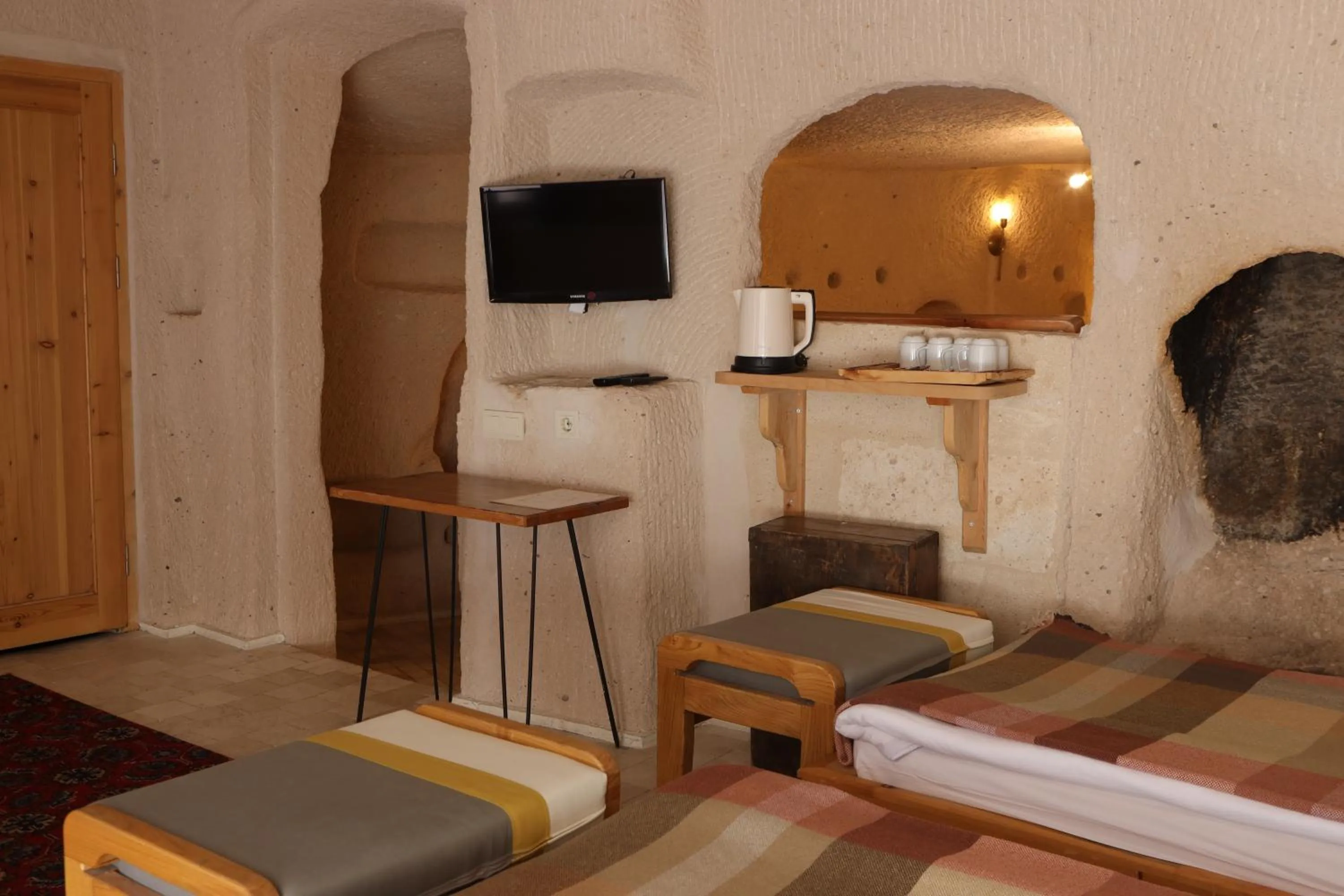 Bed in Pinhan Cave Suites