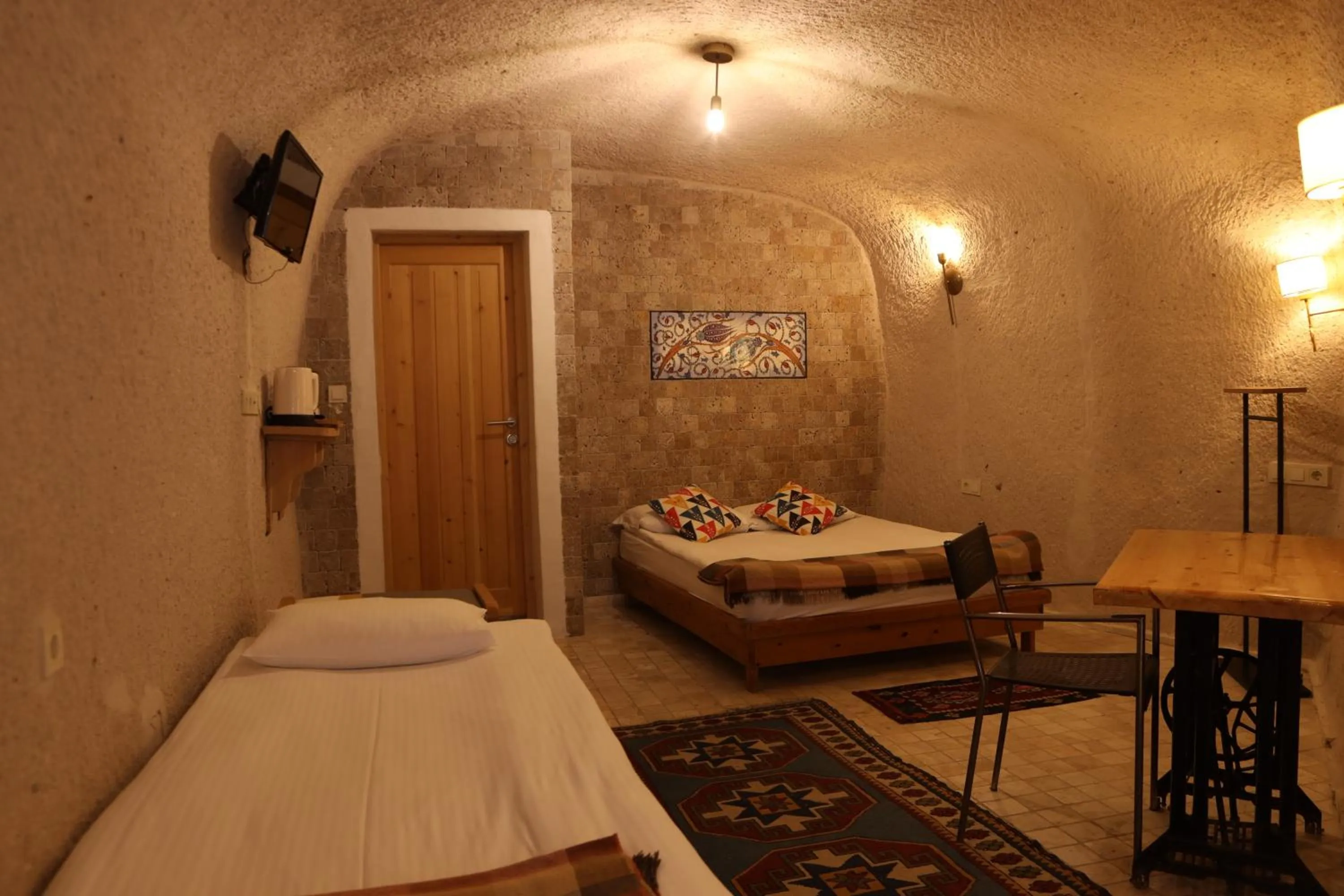 Bed in Pinhan Cave Suites