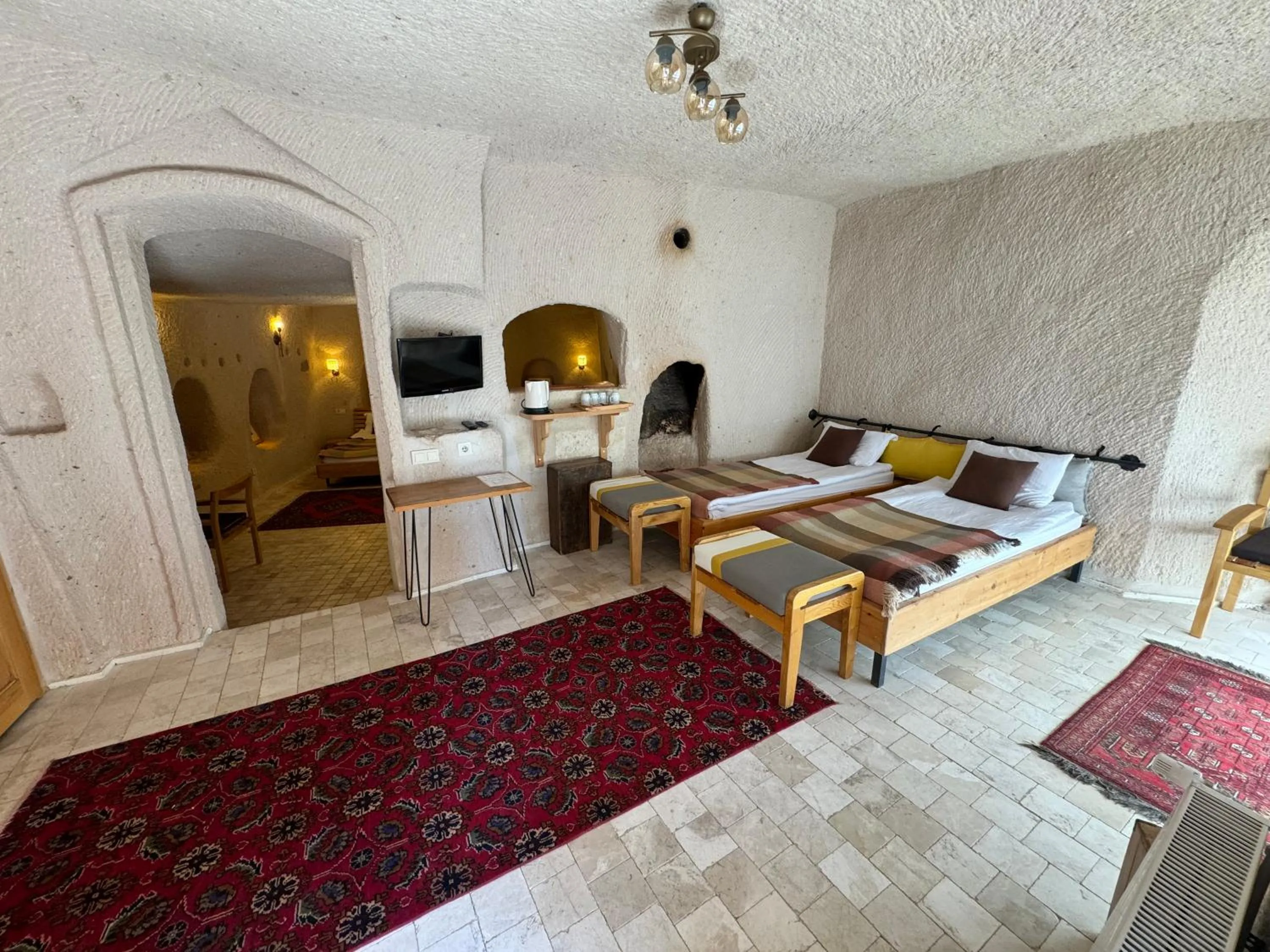 Bed in Pinhan Cave Suites