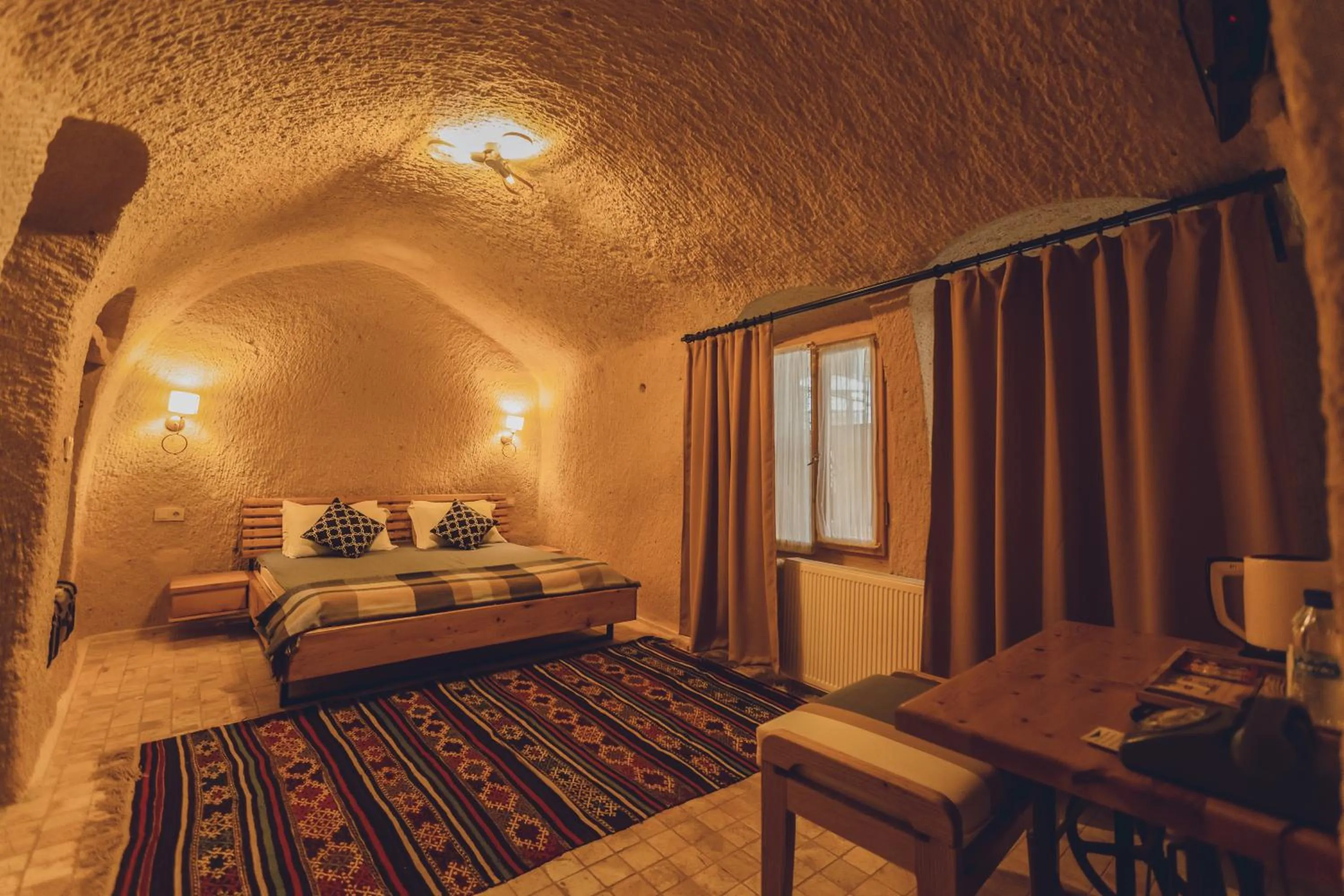 Bed in Pinhan Cave Suites