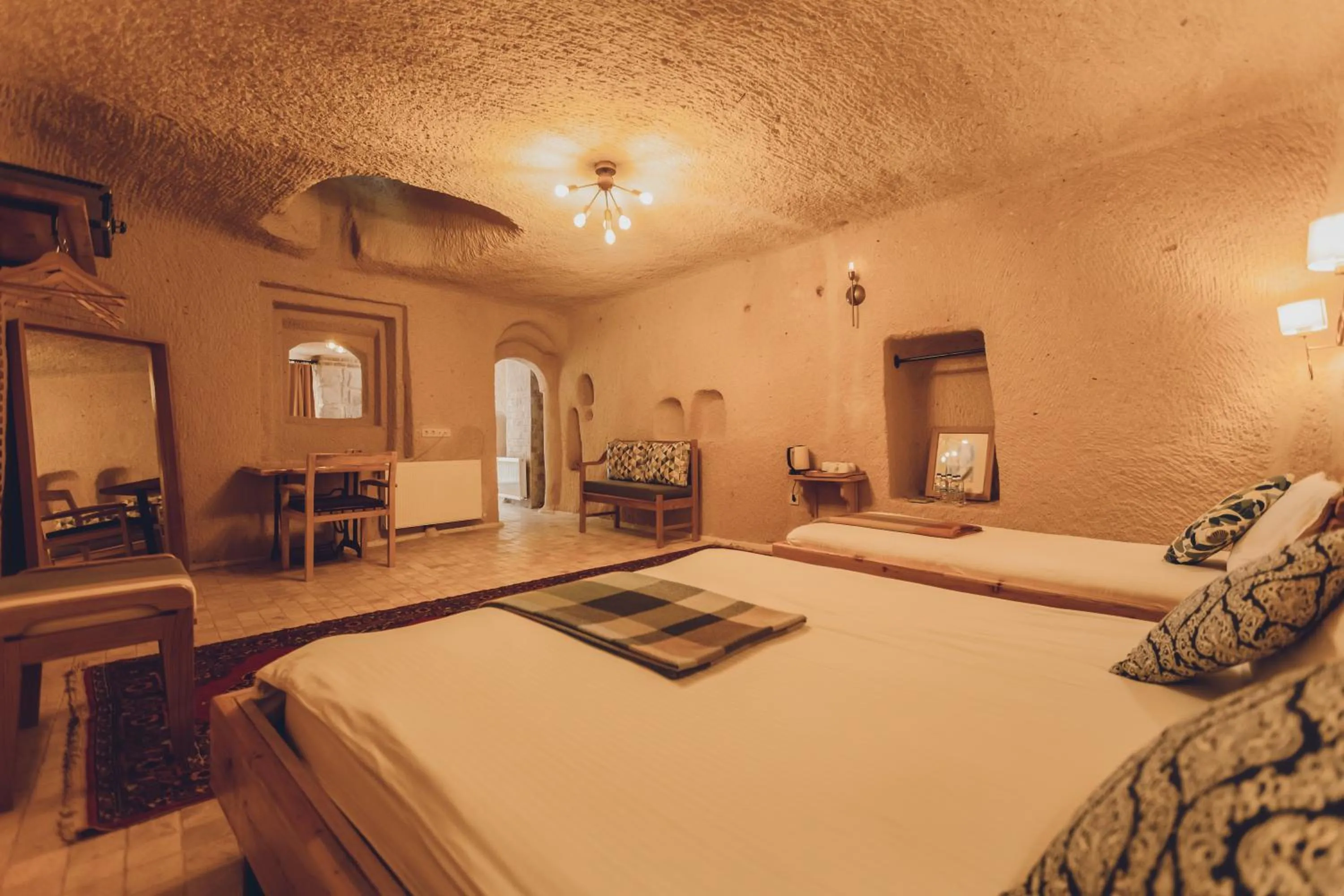 Bed in Pinhan Cave Suites