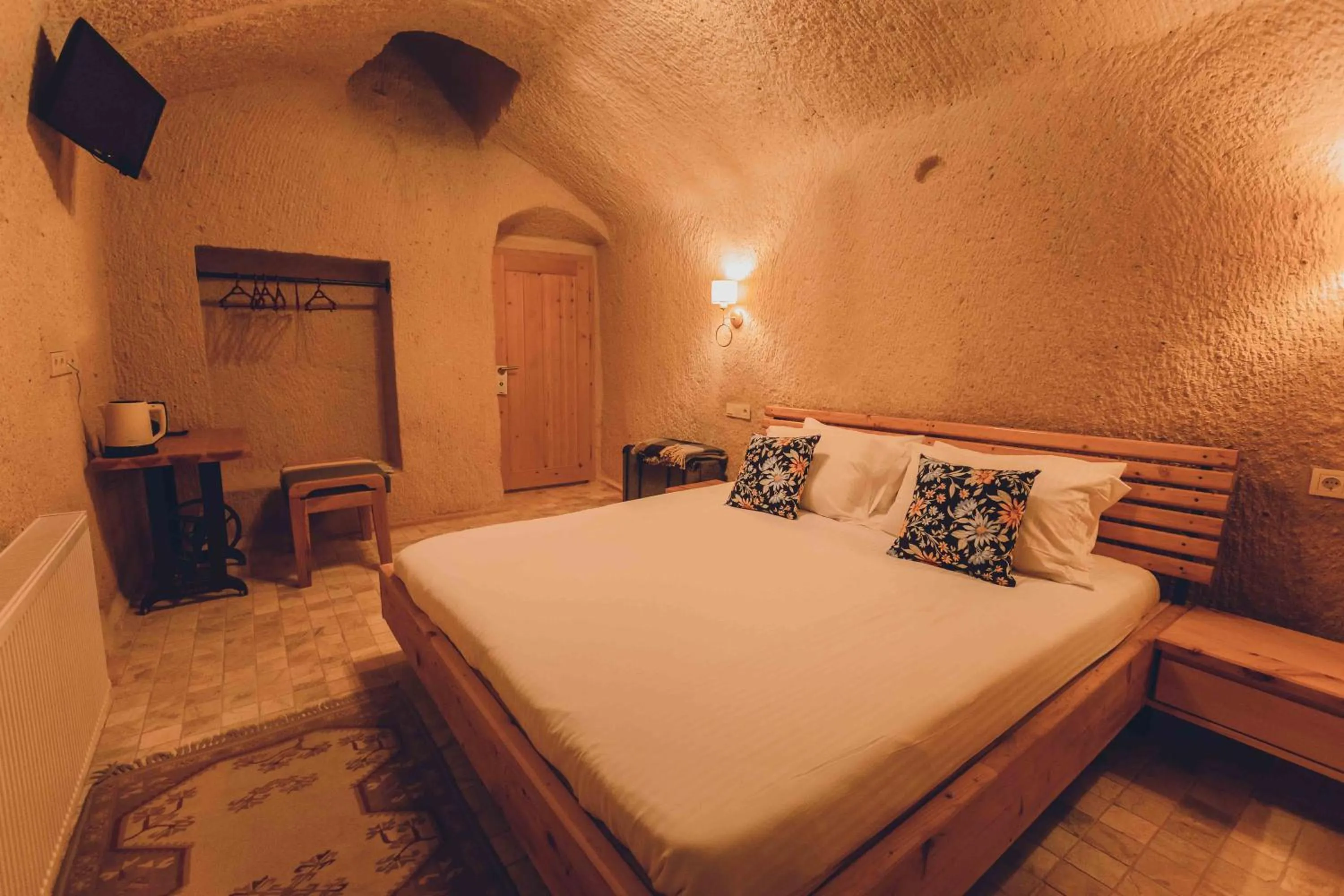 Bed in Pinhan Cave Suites
