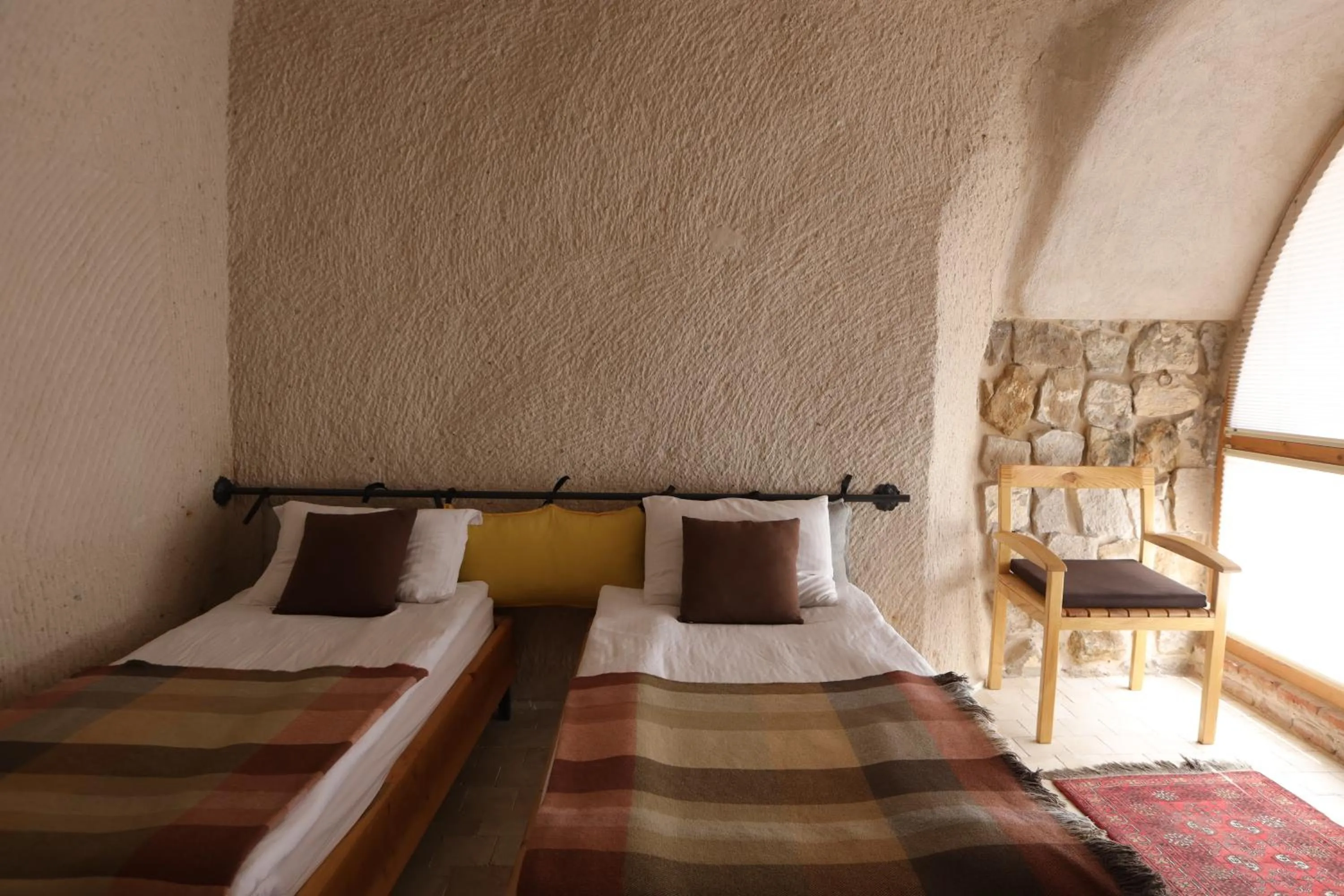 Bed in Pinhan Cave Suites