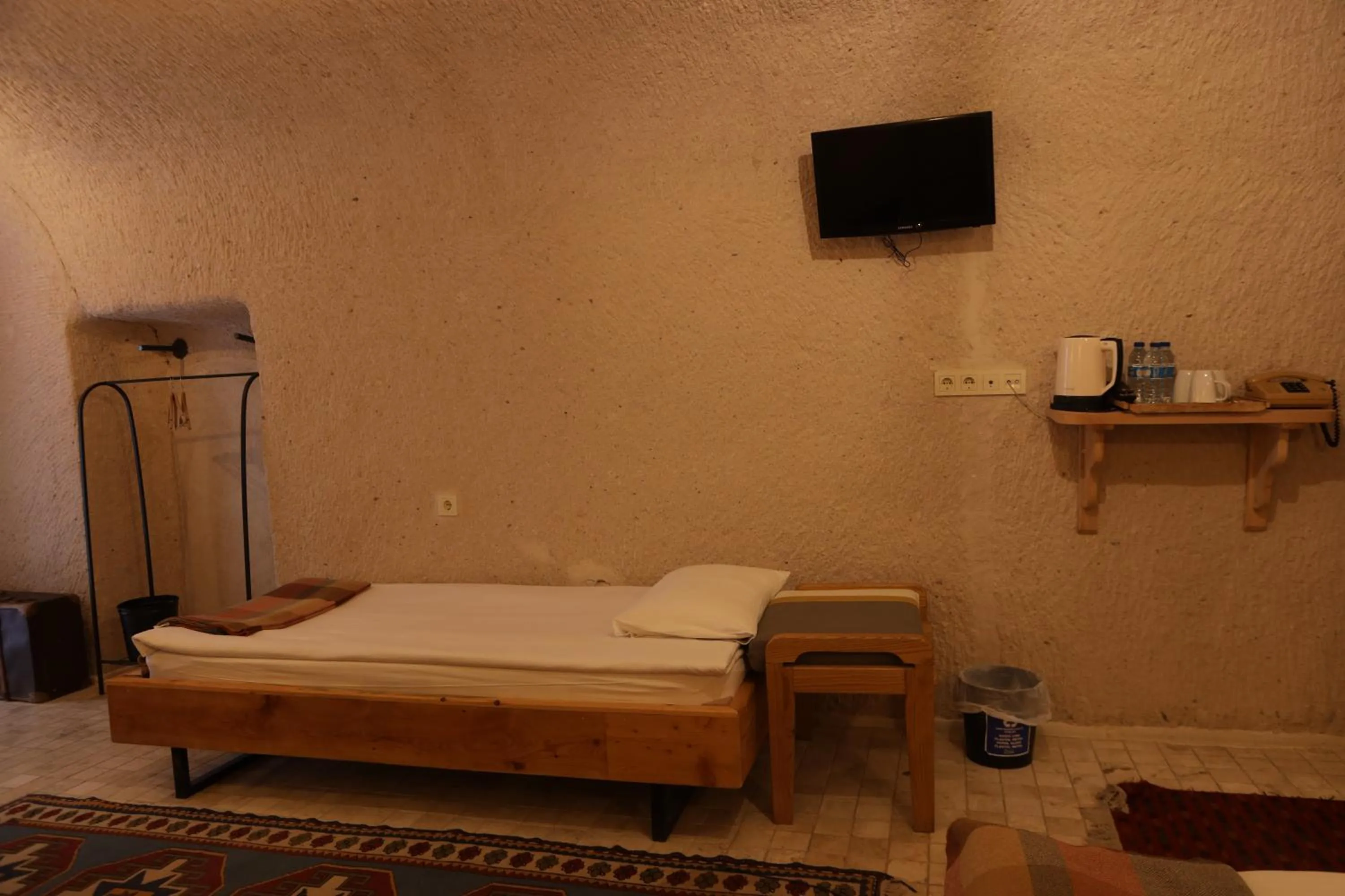 Bed in Pinhan Cave Suites