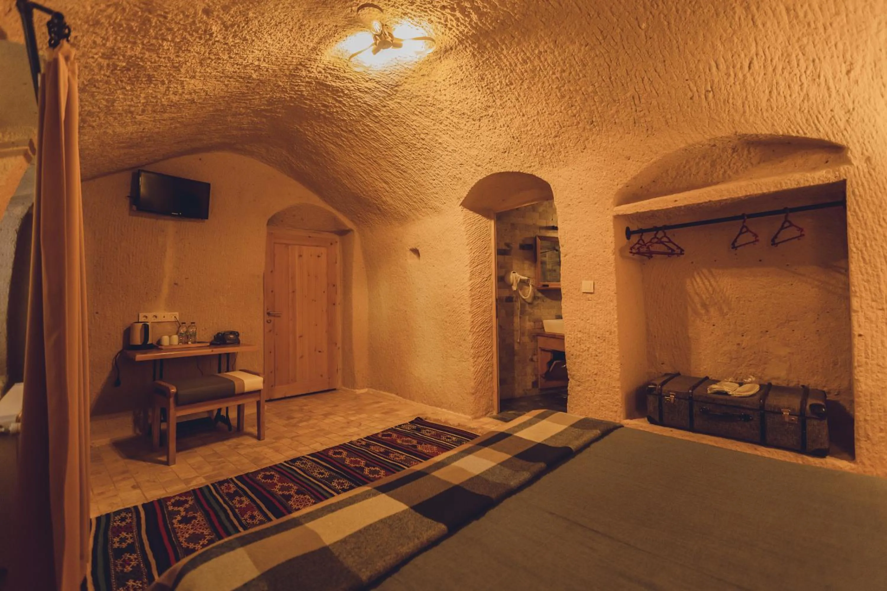 Bed in Pinhan Cave Suites