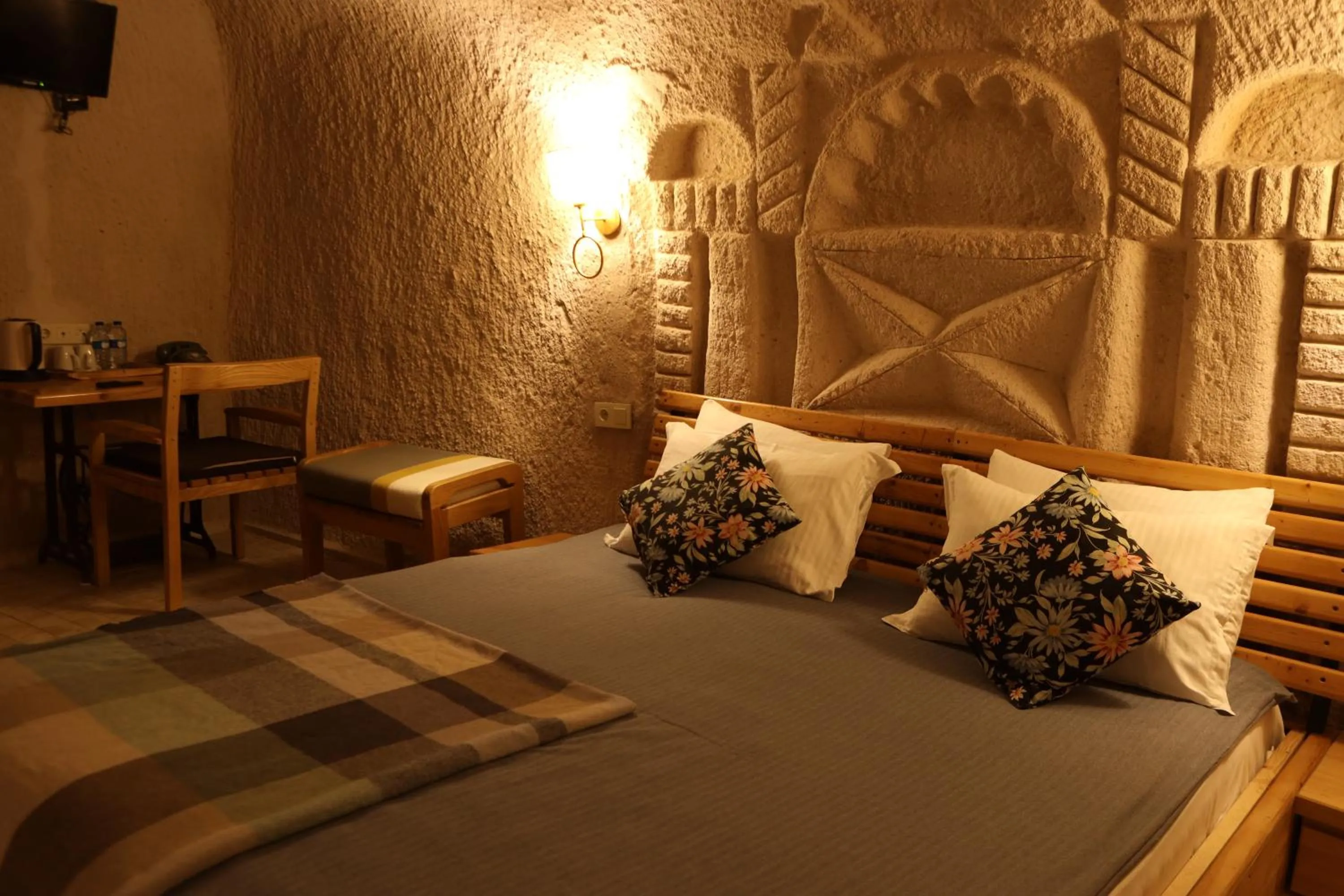 Bed in Pinhan Cave Suites