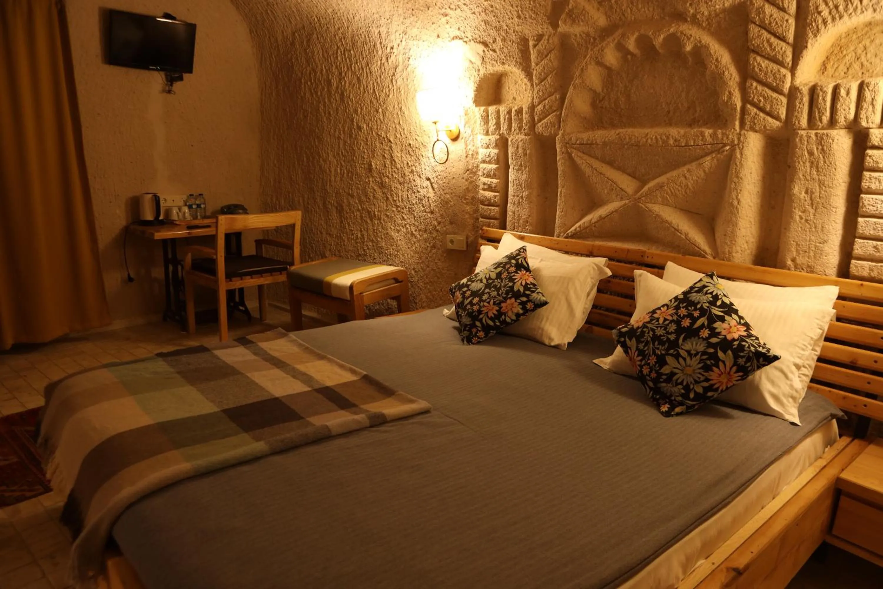 Bed in Pinhan Cave Suites