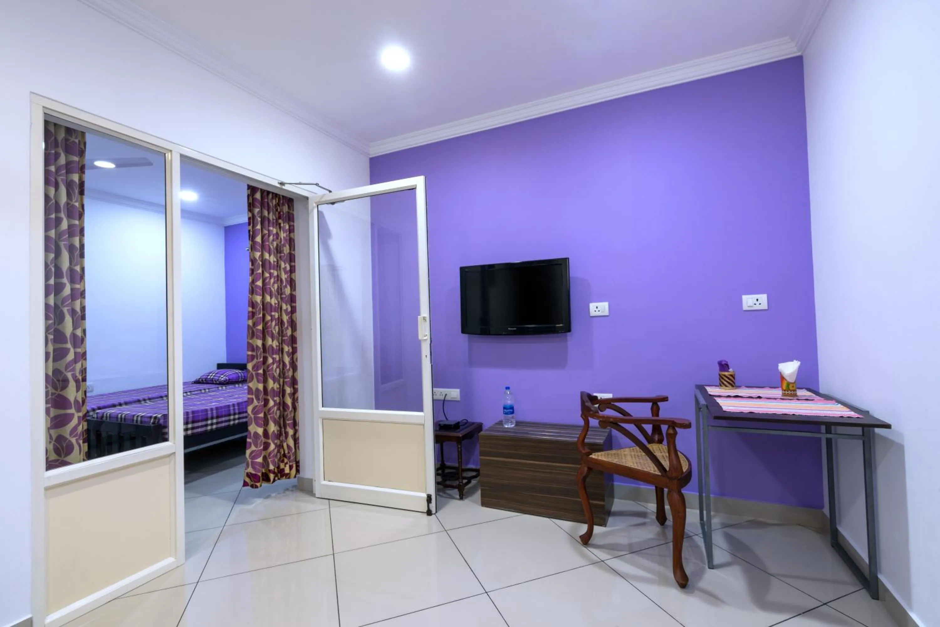 Dining area, Bed in Vasudevam Premium Suites