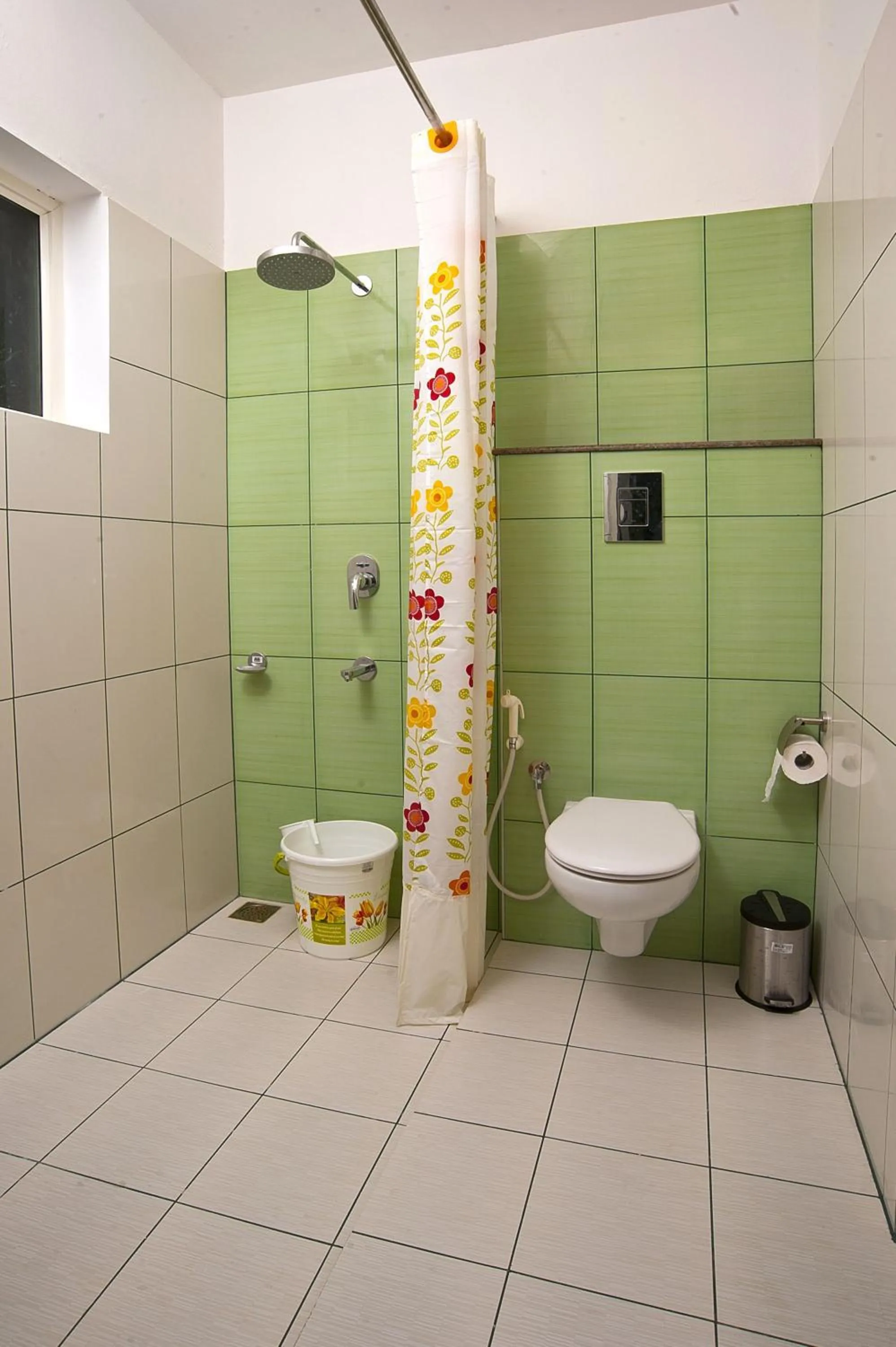 Toilet in Vasudevam Premium Suites