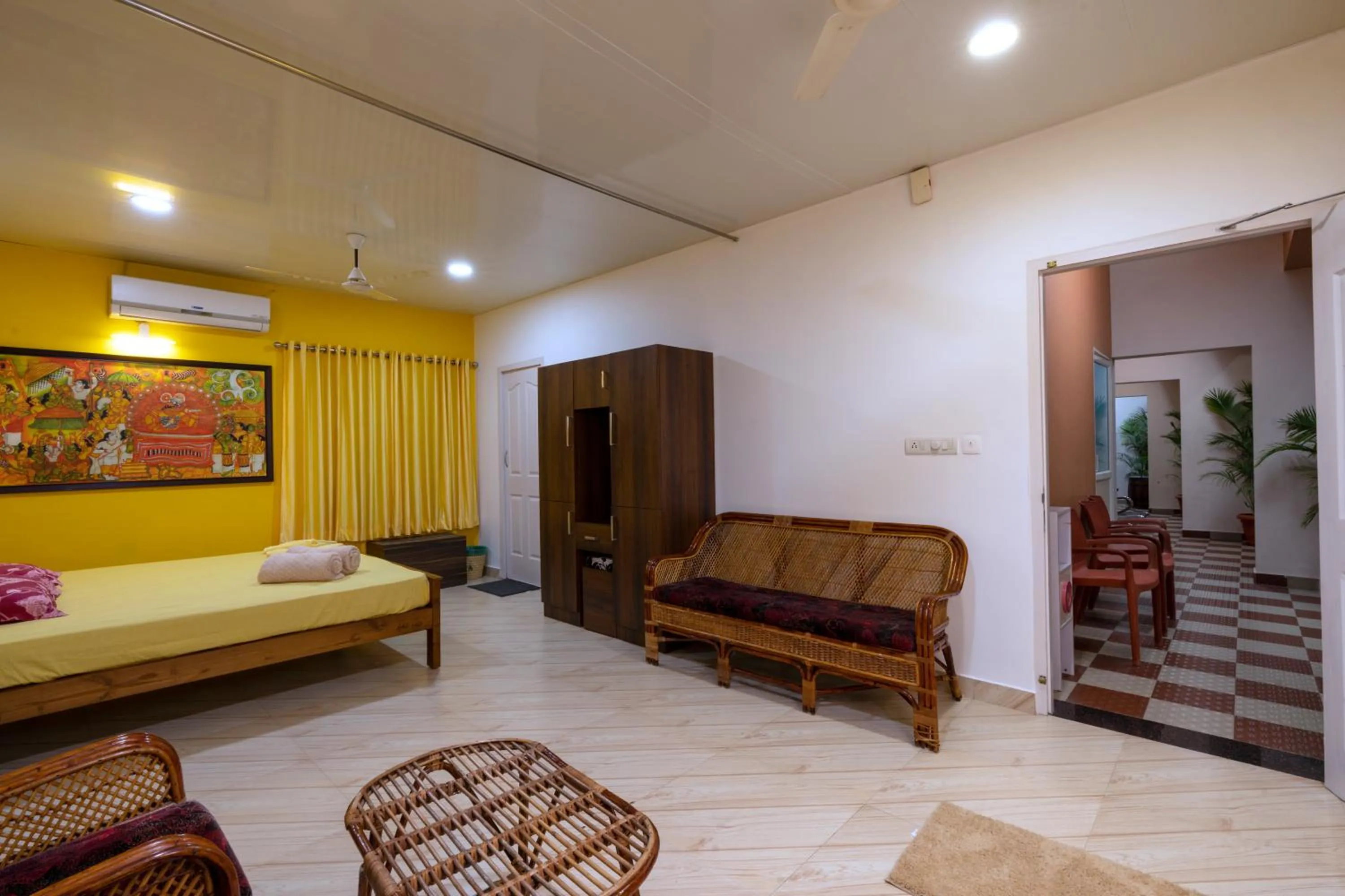 Living room, Bed in Vasudevam Premium Suites