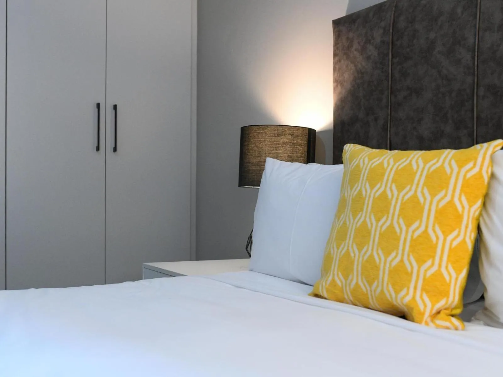 Bed in Next To Apartment Hotel