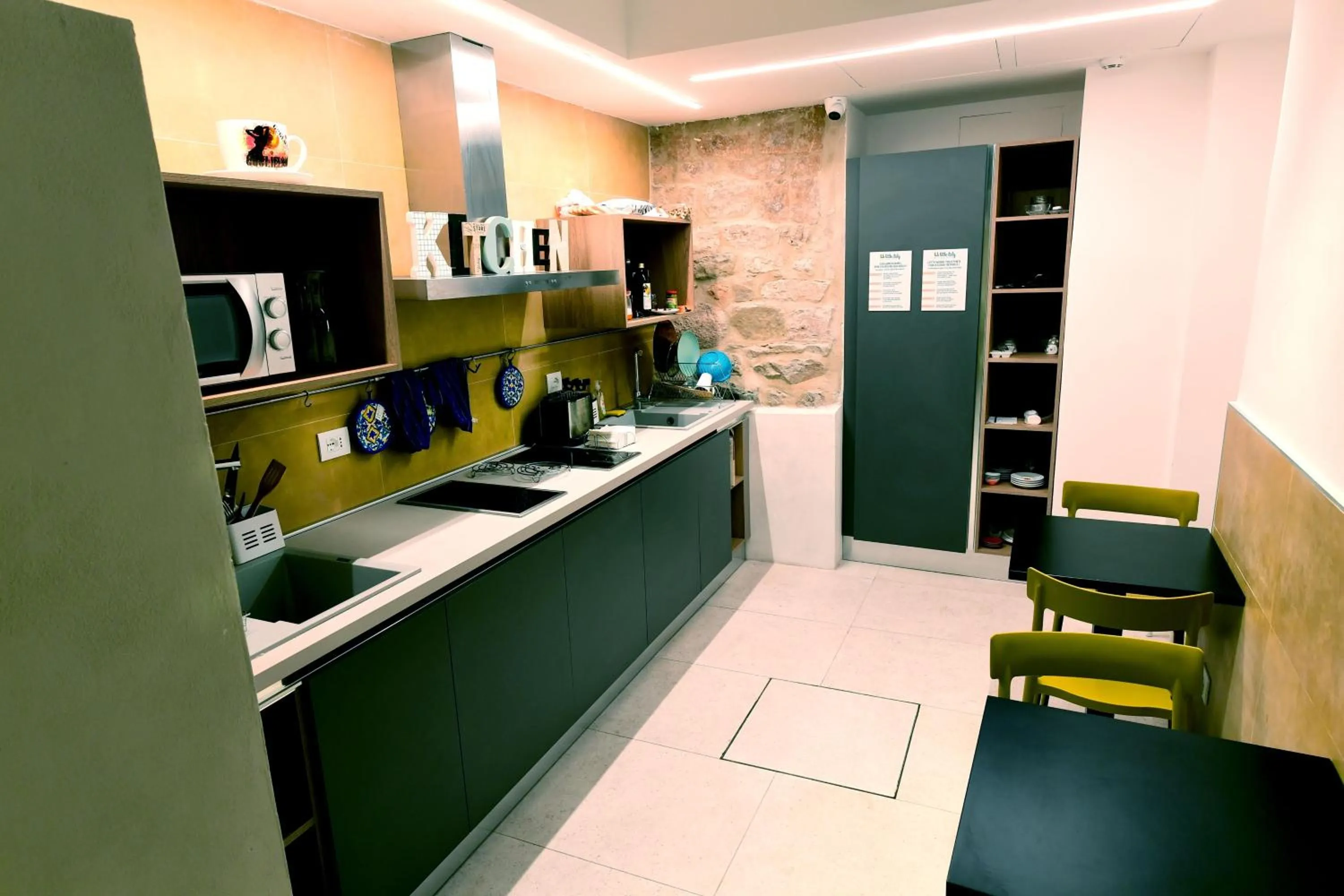 Communal kitchen in Little Italy Hostel Ex Chiesa S Donato