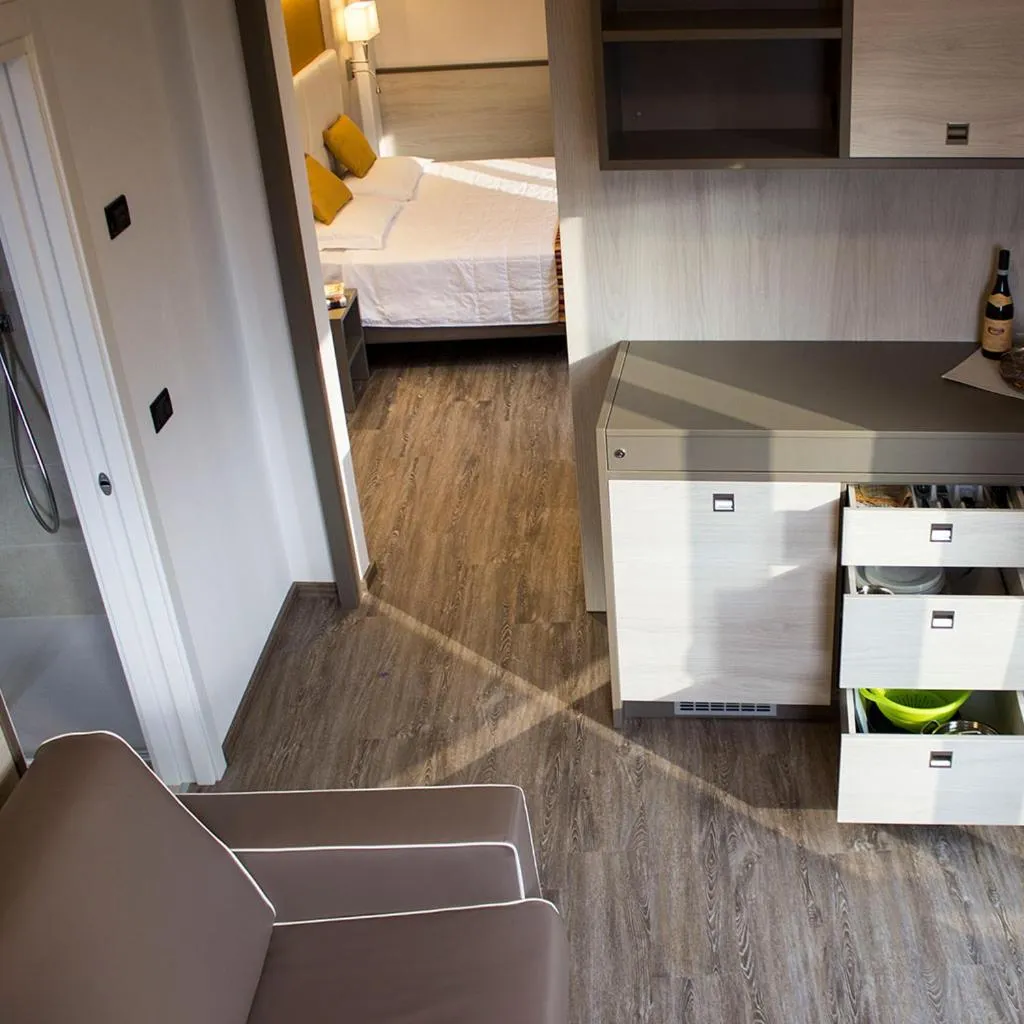 Kitchen or kitchenette, Bed in Hotel Dolomiti