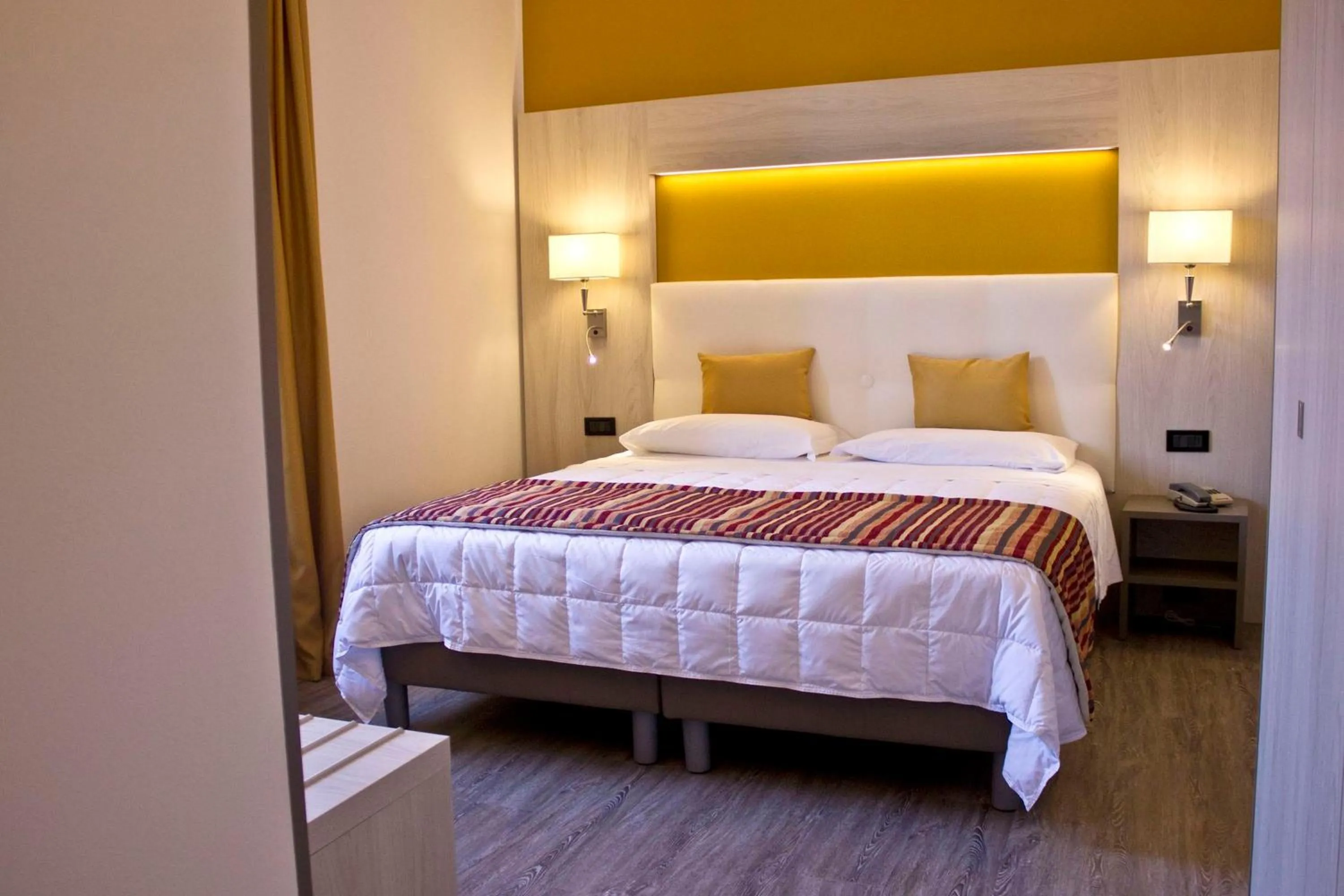 Bed in Hotel Dolomiti