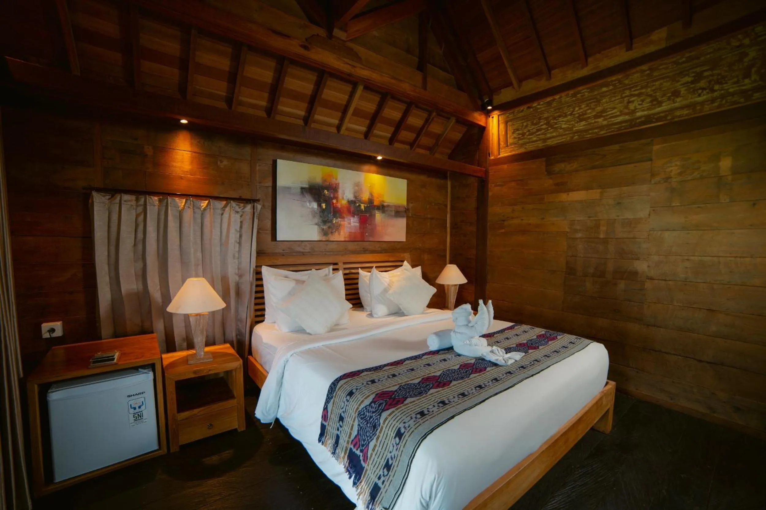 Bed in Kubu Sakian Villa and Restaurant Sidemen