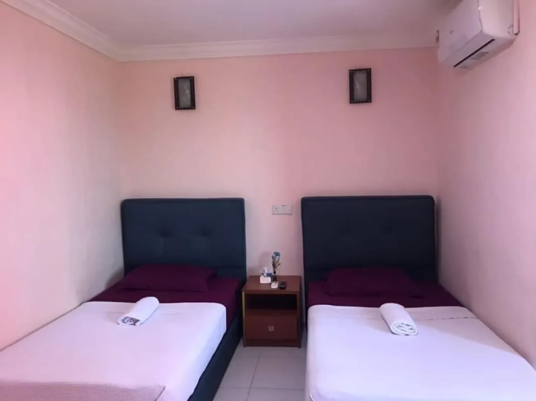 Bed in TAMIM SUITE GROUP HOTEL Dungun