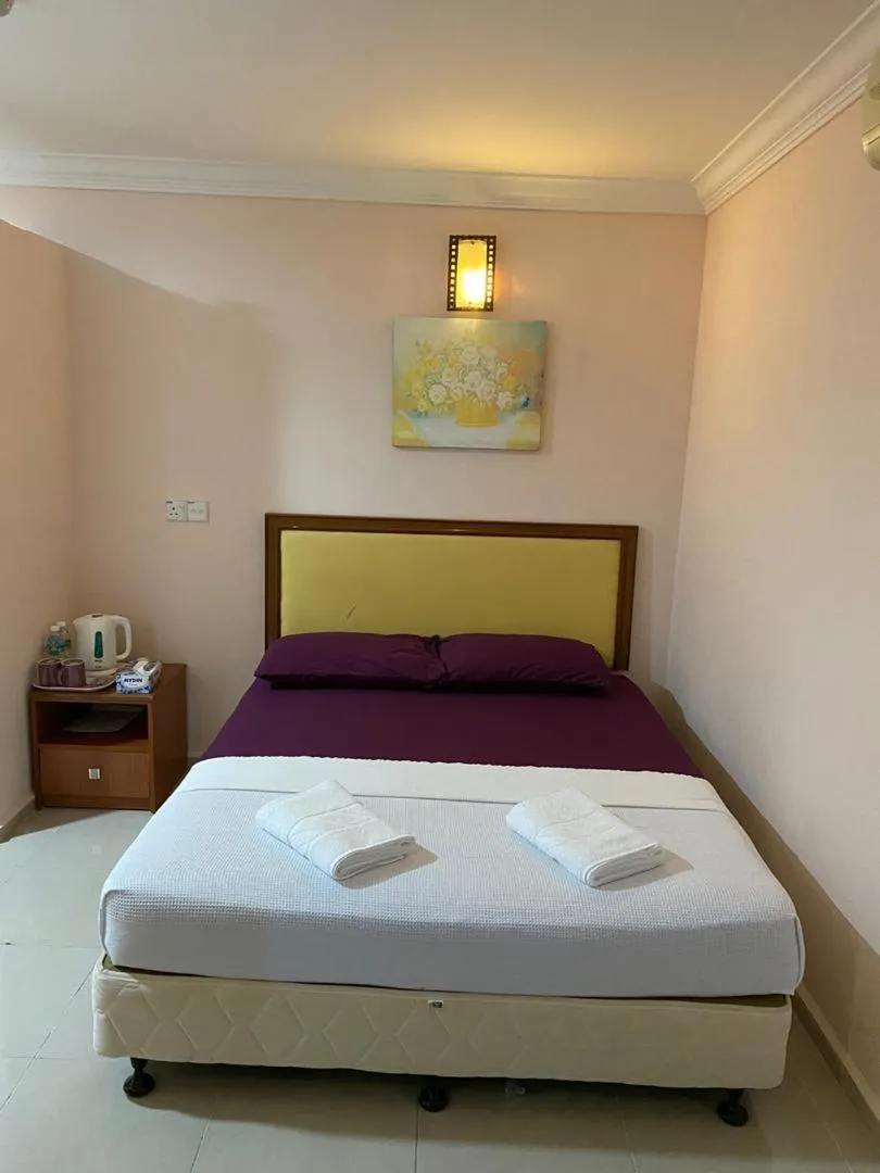 Photo of the whole room, Bed in TAMIM SUITE GROUP HOTEL Dungun