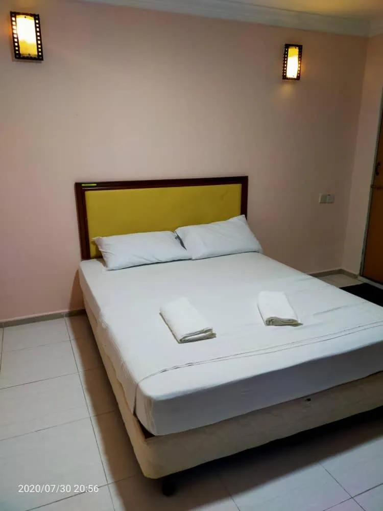 Photo of the whole room, Bed in TAMIM SUITE GROUP HOTEL Dungun