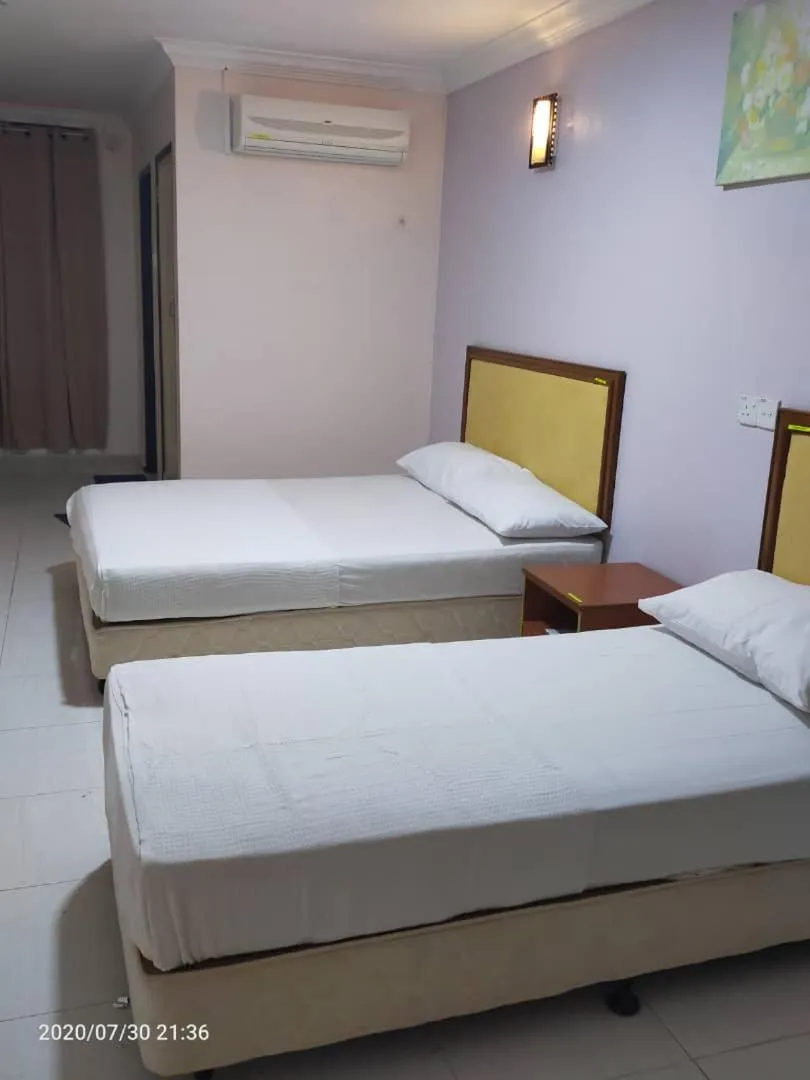 Photo of the whole room, Bed in TAMIM SUITE GROUP HOTEL Dungun