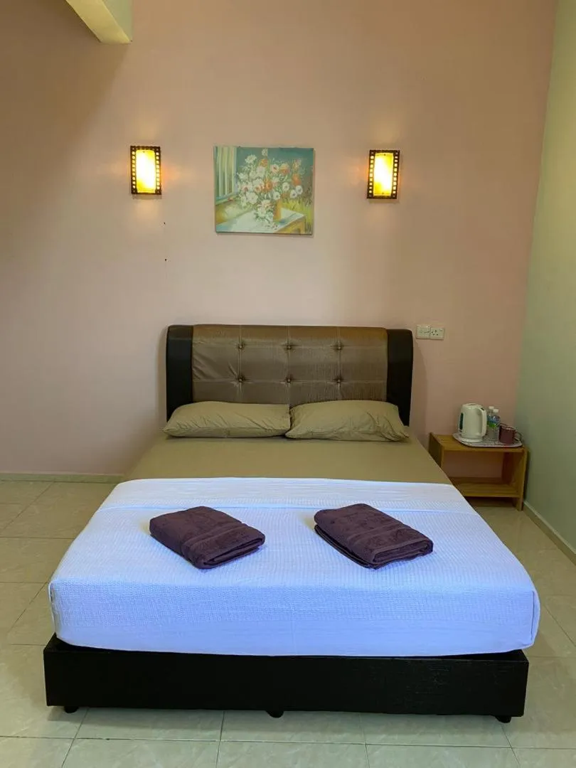 Photo of the whole room, Bed in TAMIM SUITE GROUP HOTEL Dungun