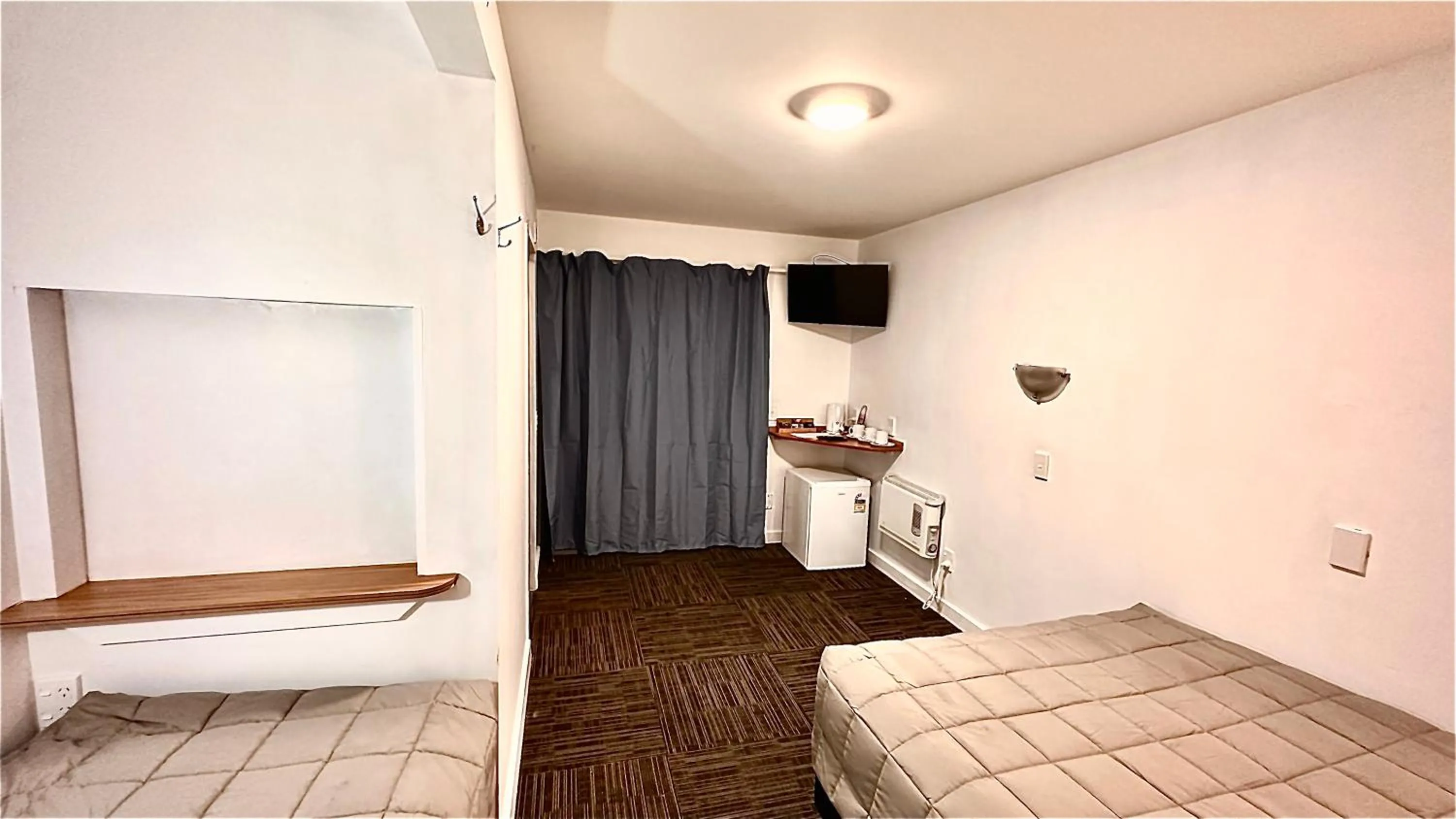 Bed in Fox Glacier Jade Hotel