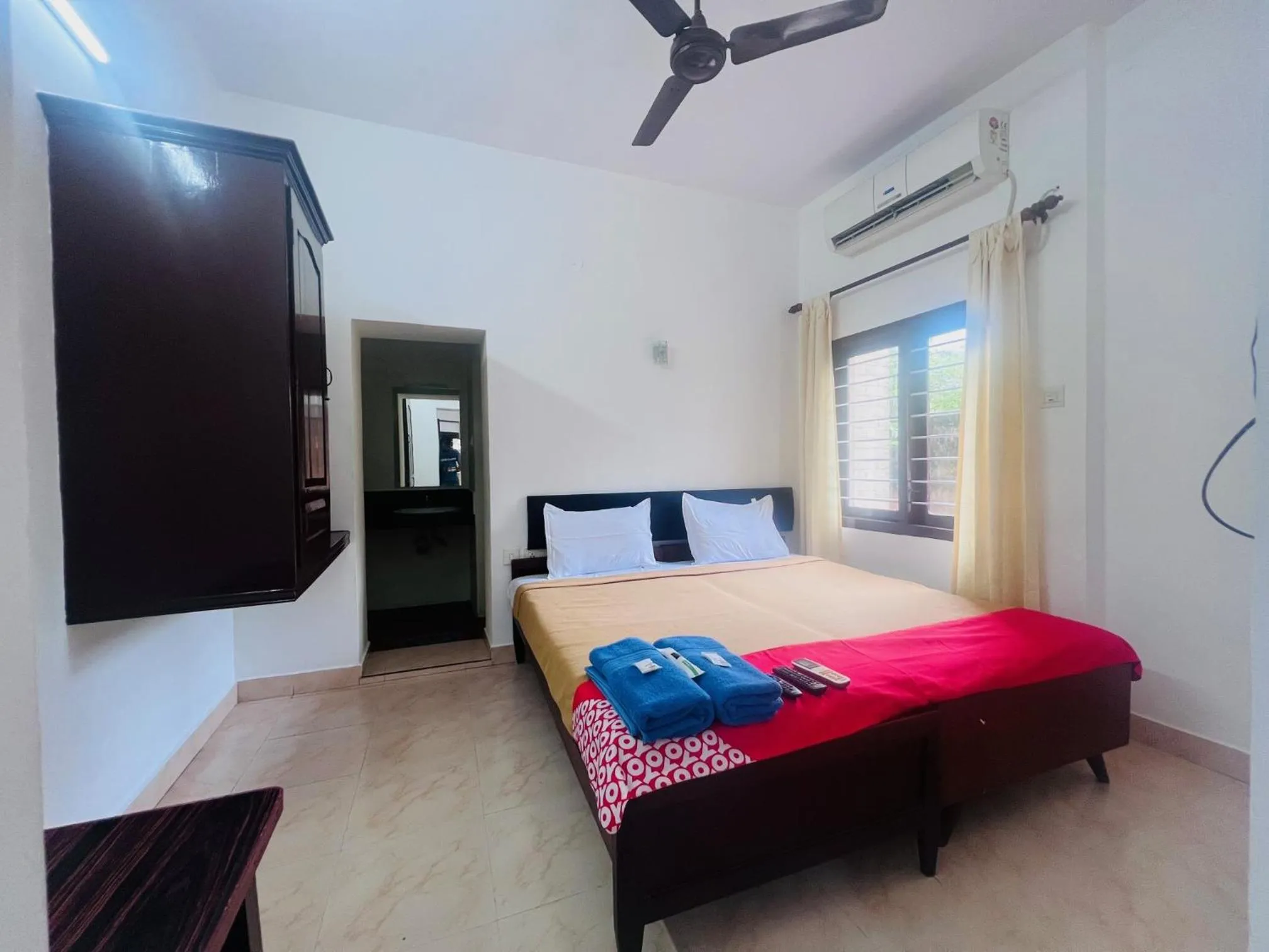 Photo of the whole room, Bed in Hotel Sunday - Townhouse Club Airport Trivandrum