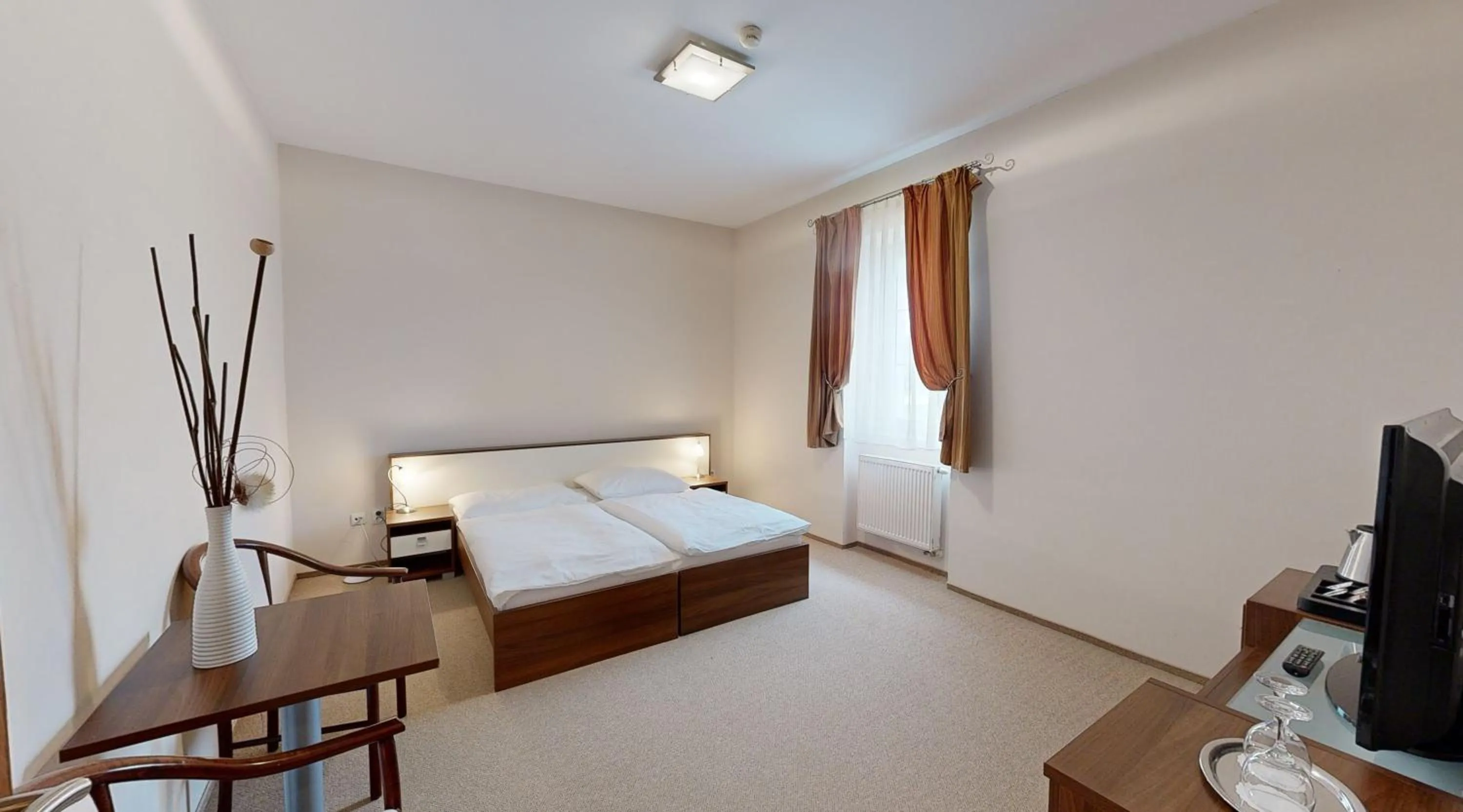 Bedroom in Apex Hotel