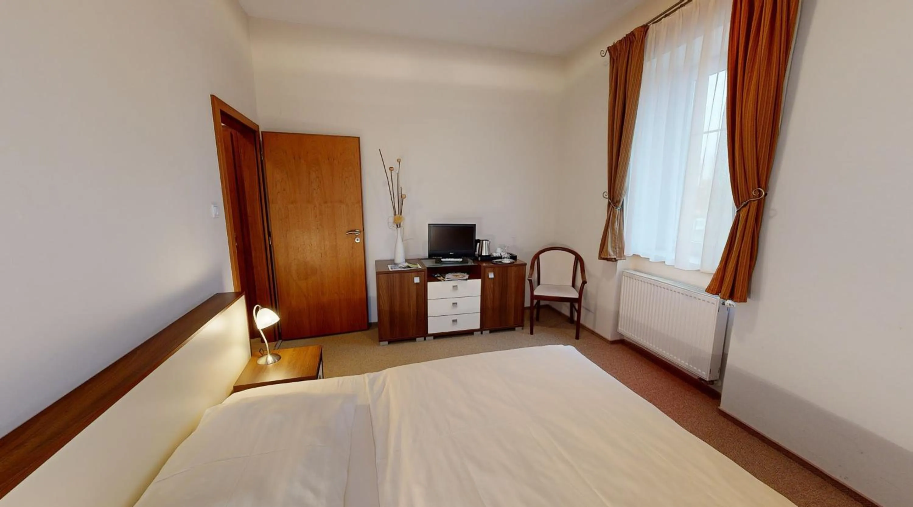 Bedroom in Apex Hotel