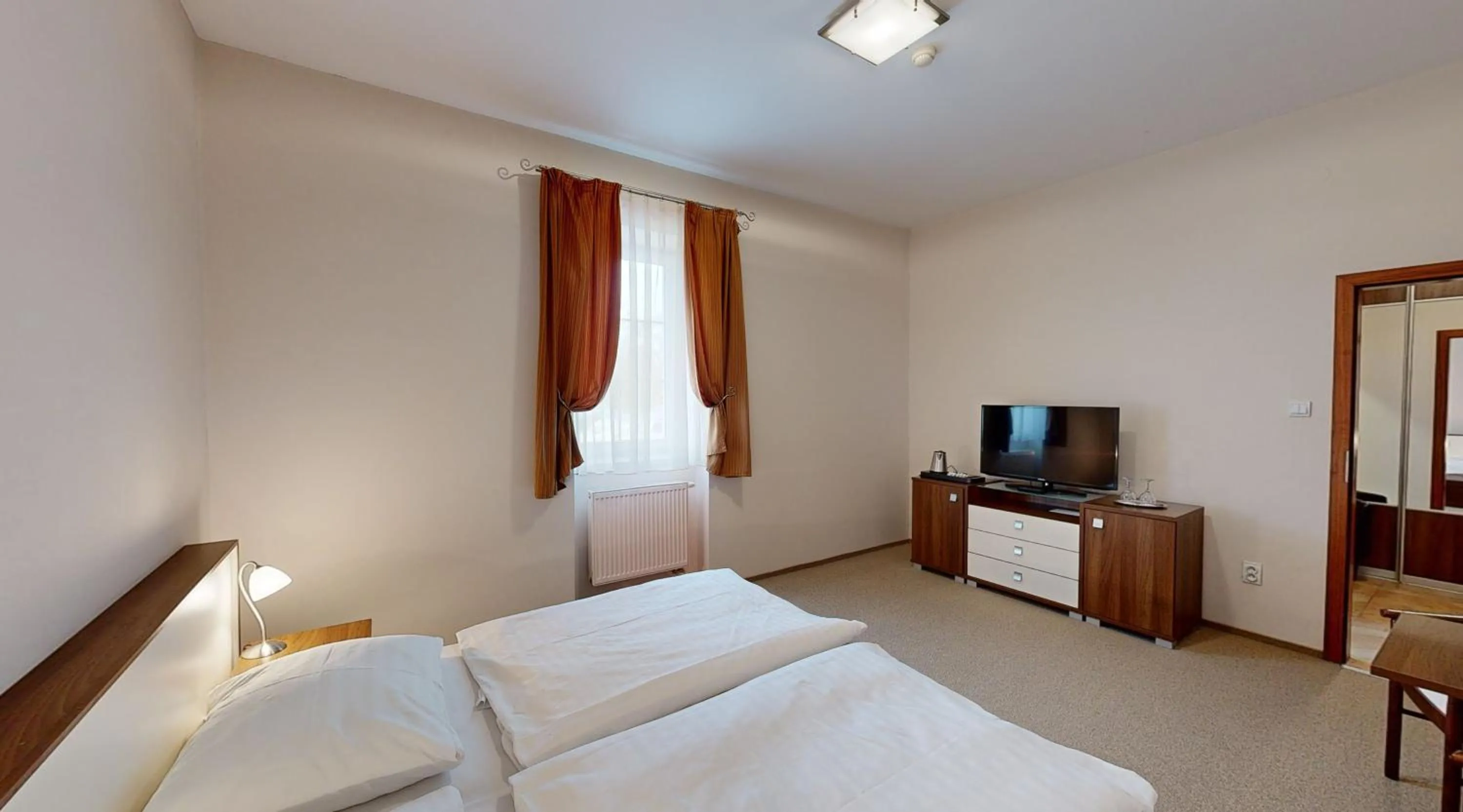 Bedroom in Apex Hotel