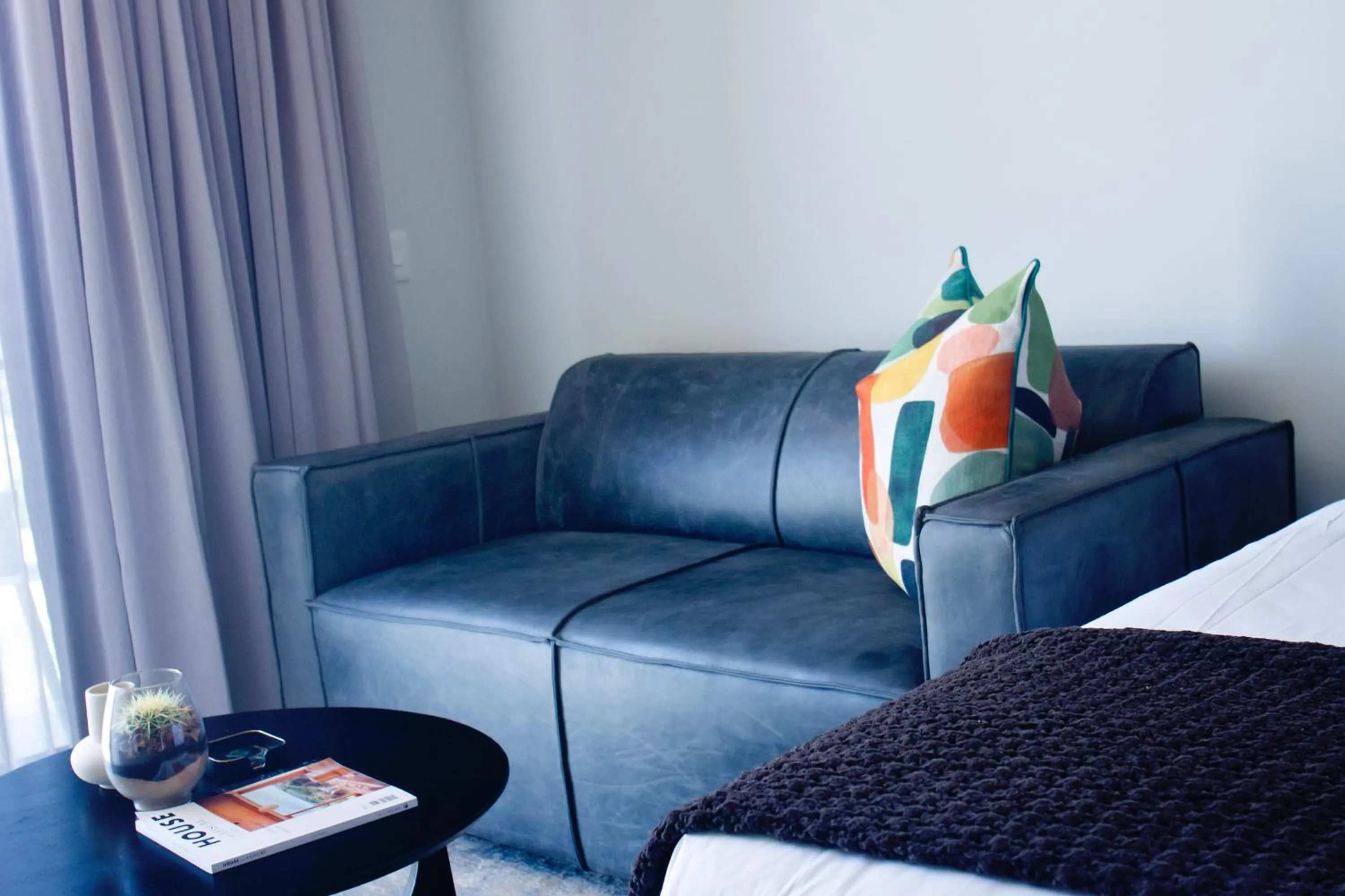 Seating area, Bed in Executive Apartment at Ellipse Waterfall