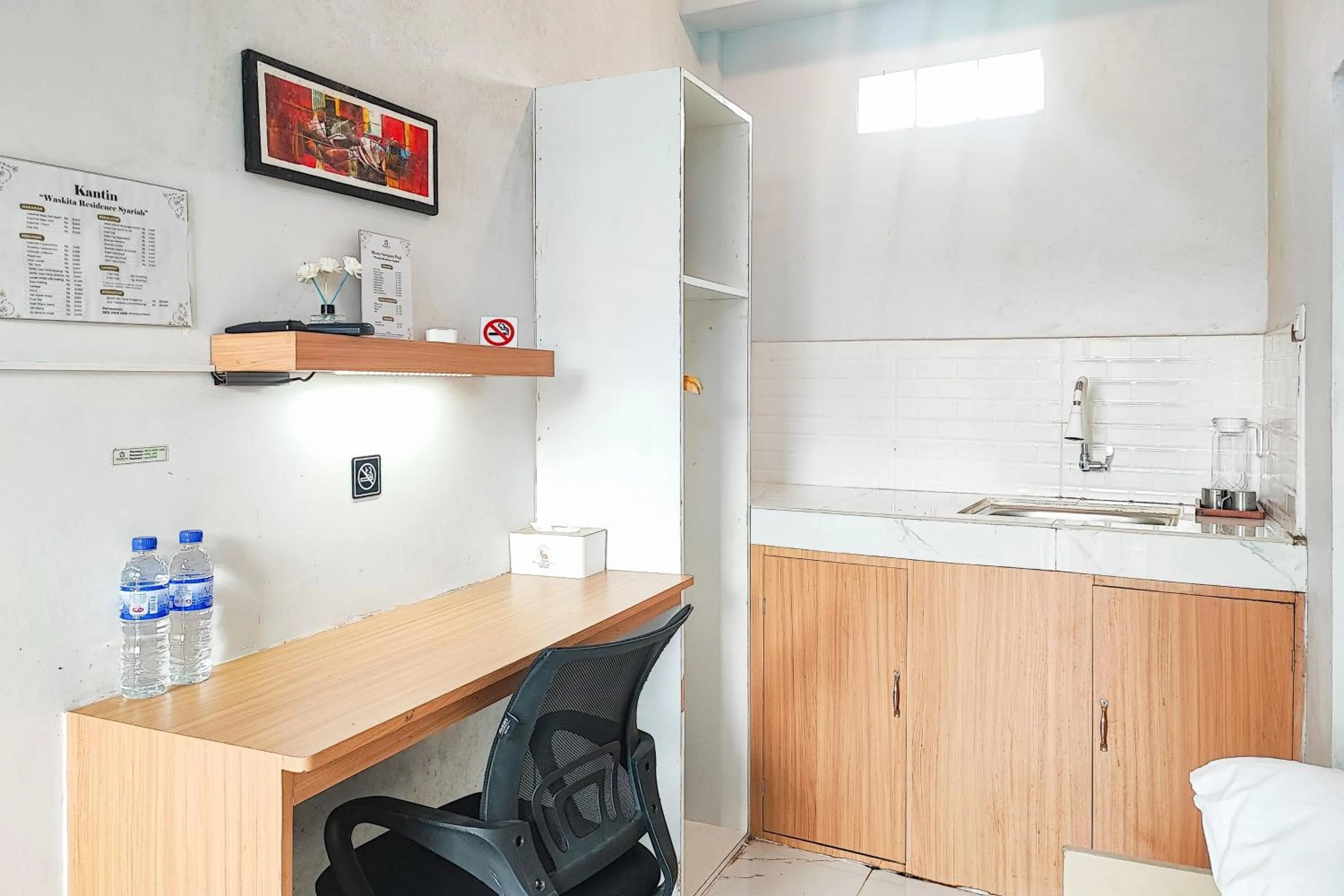 Seating area in Urbanview Hotel Syariah at Waskita Residence Telanaipura