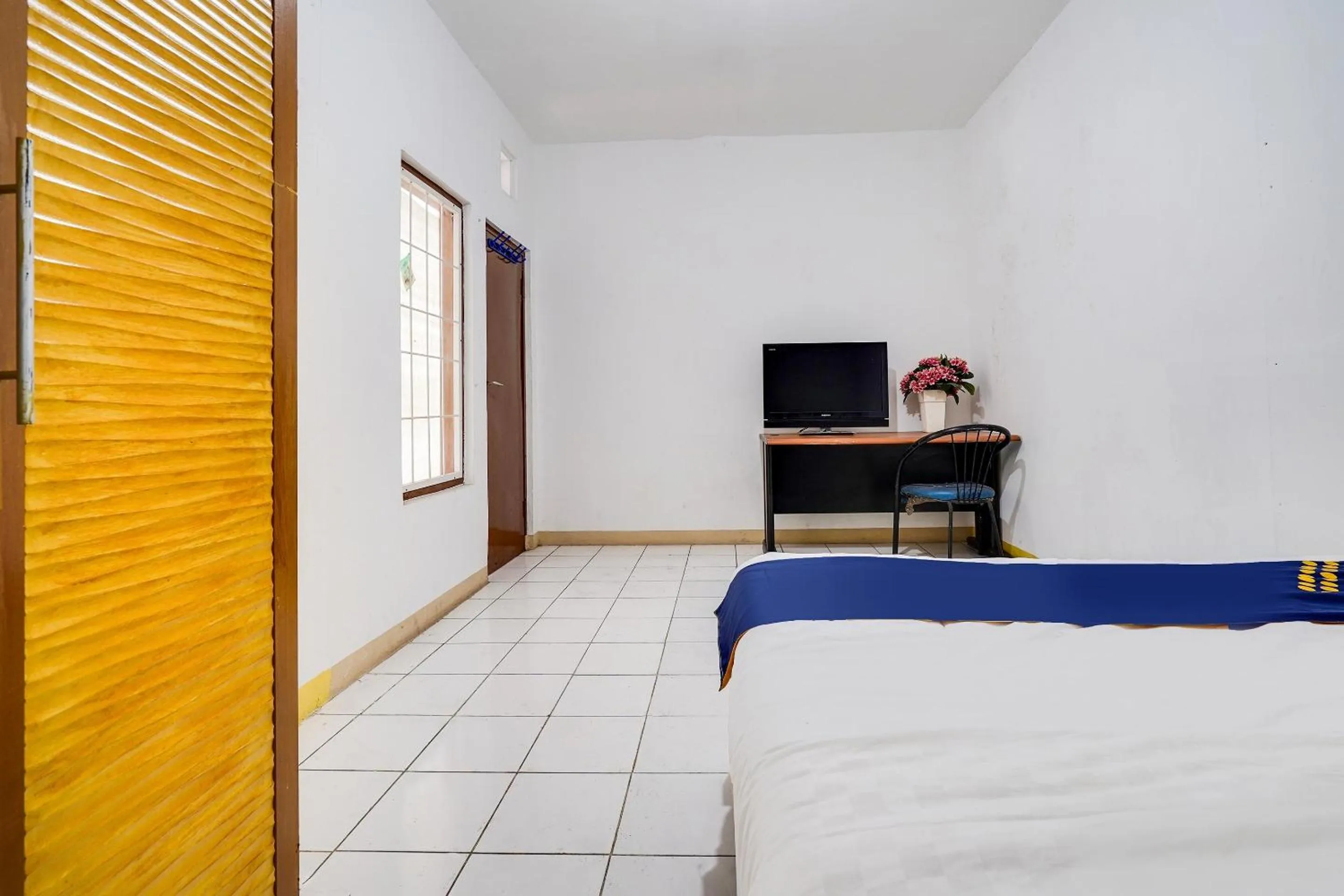 Bedroom in OYO 91546 Dewi Sudirman Homestay