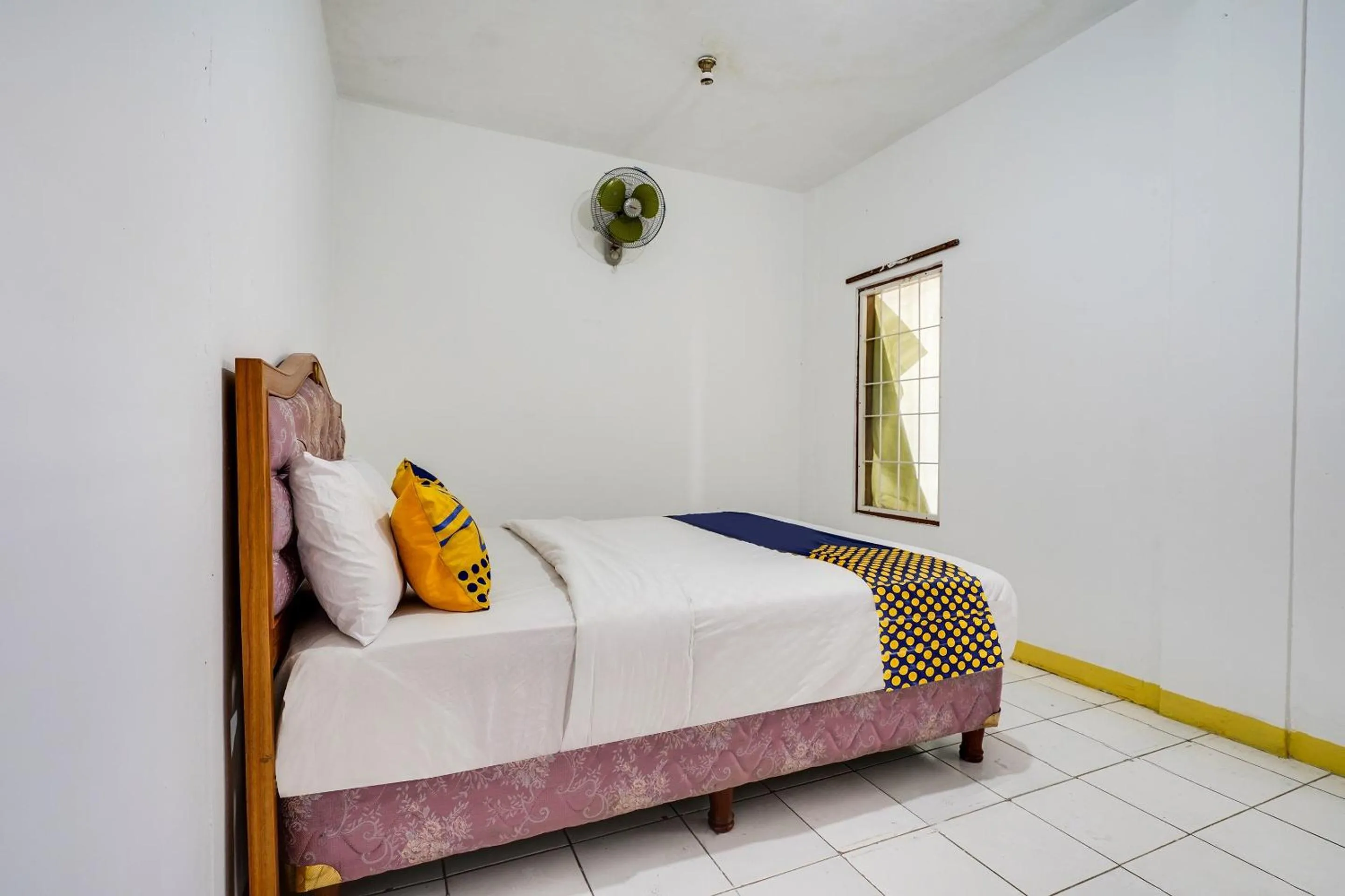 Bedroom in OYO 91546 Dewi Sudirman Homestay