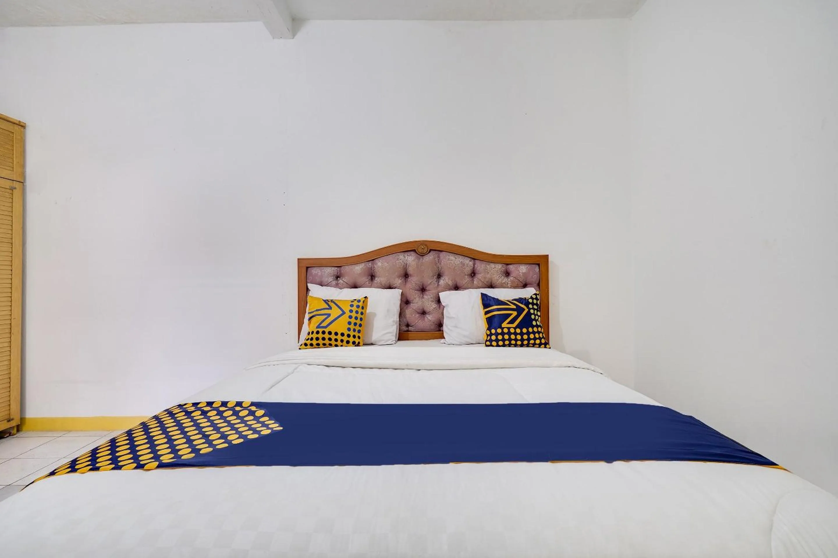 Bedroom in OYO 91546 Dewi Sudirman Homestay