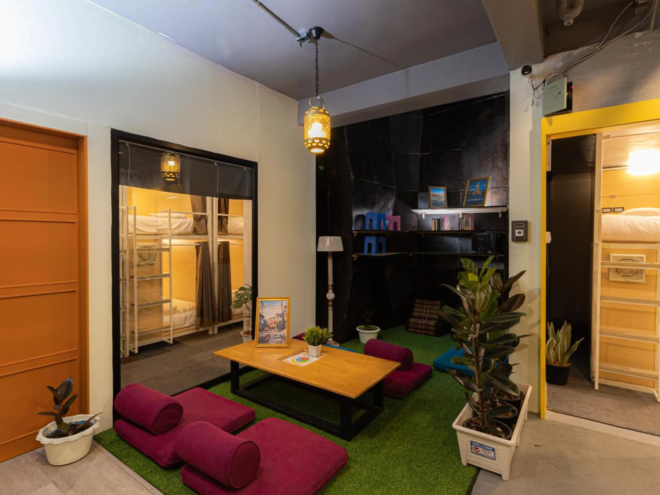 Seating area in Khao San Social Capsule Hostel