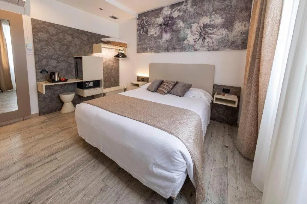 Bed in Hotel Le Palme