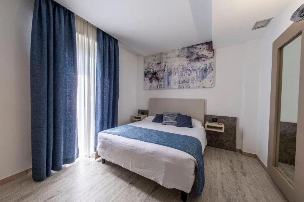 Bed in Hotel Le Palme