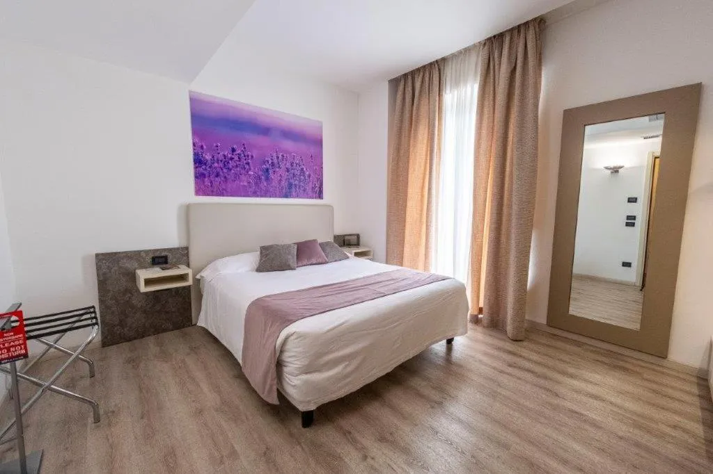 Bed in Hotel Le Palme