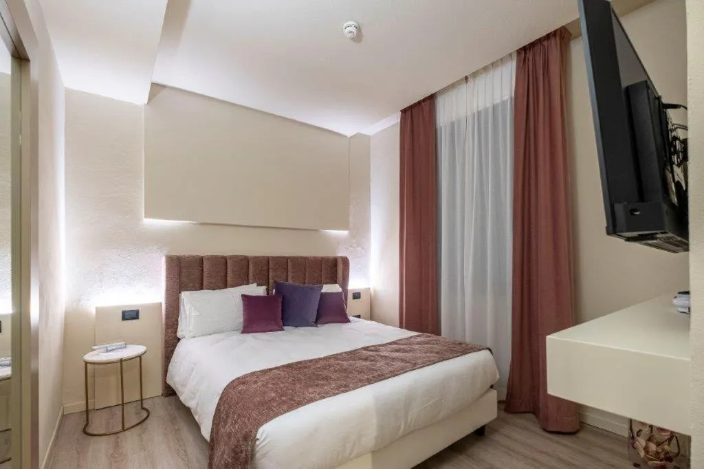 Bed in Hotel Le Palme