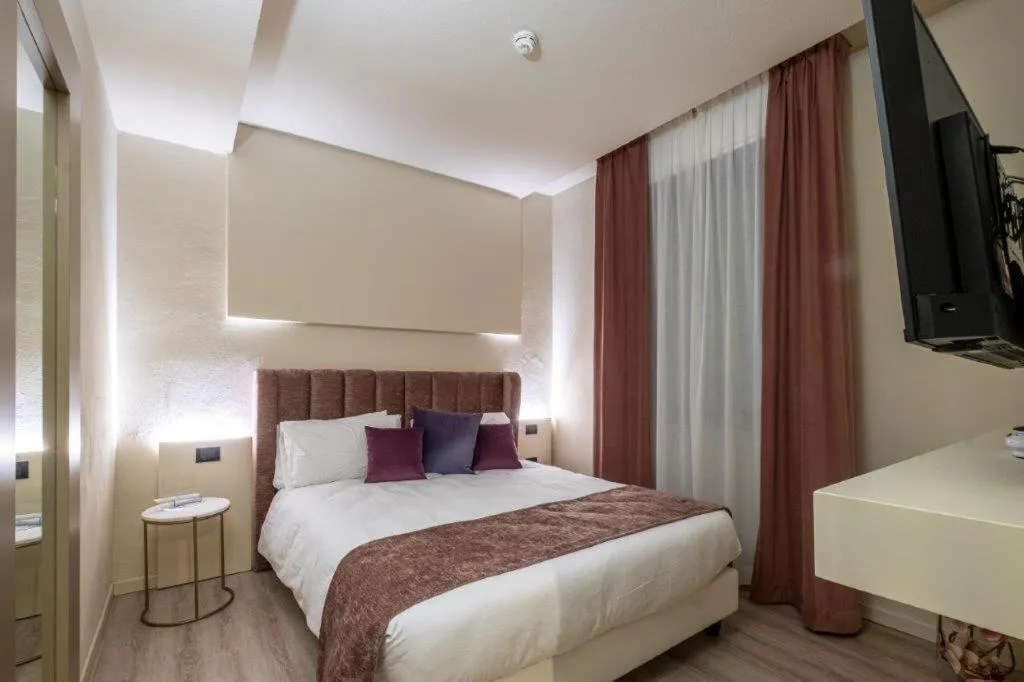 Bed in Hotel Le Palme