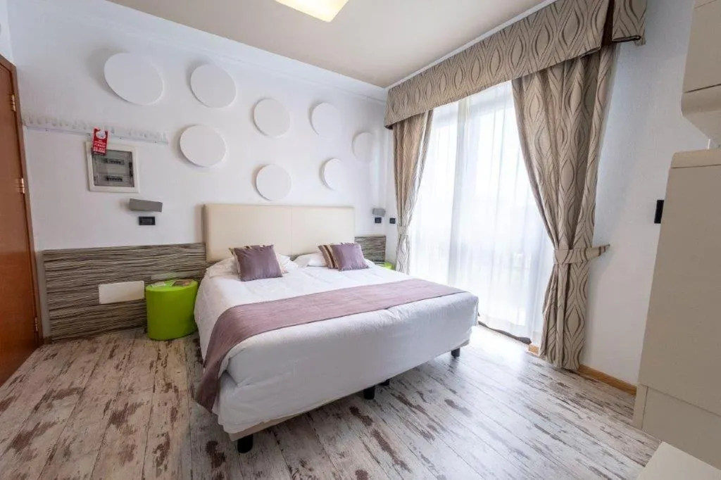 Bed in Hotel Le Palme