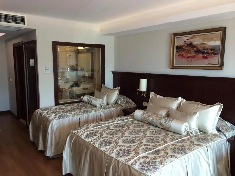 Bed in Prime Boutique Hotel