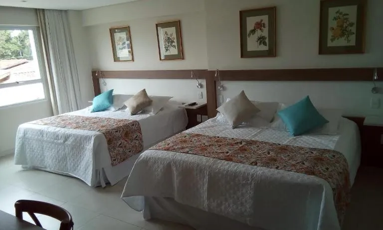 Bed in Lirio D'Água Hotel
