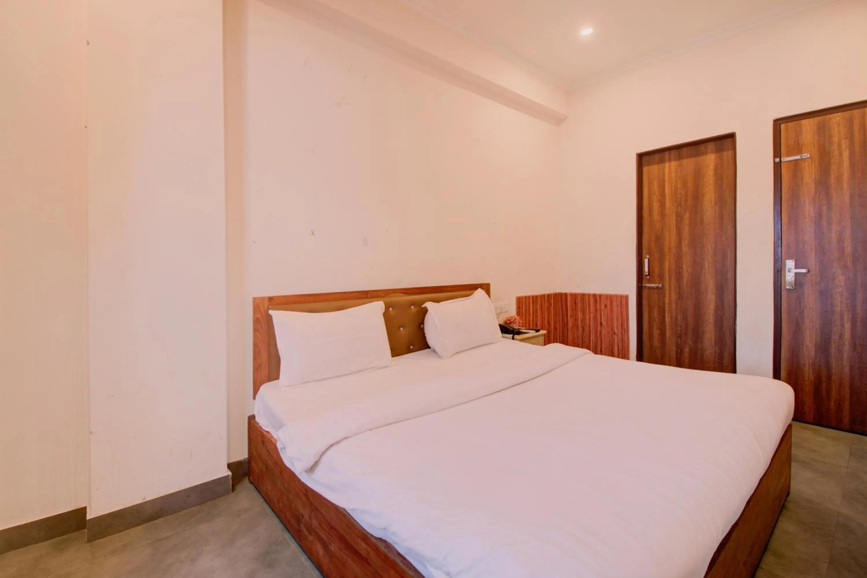 Bed in Hotel Bhagwati Palace