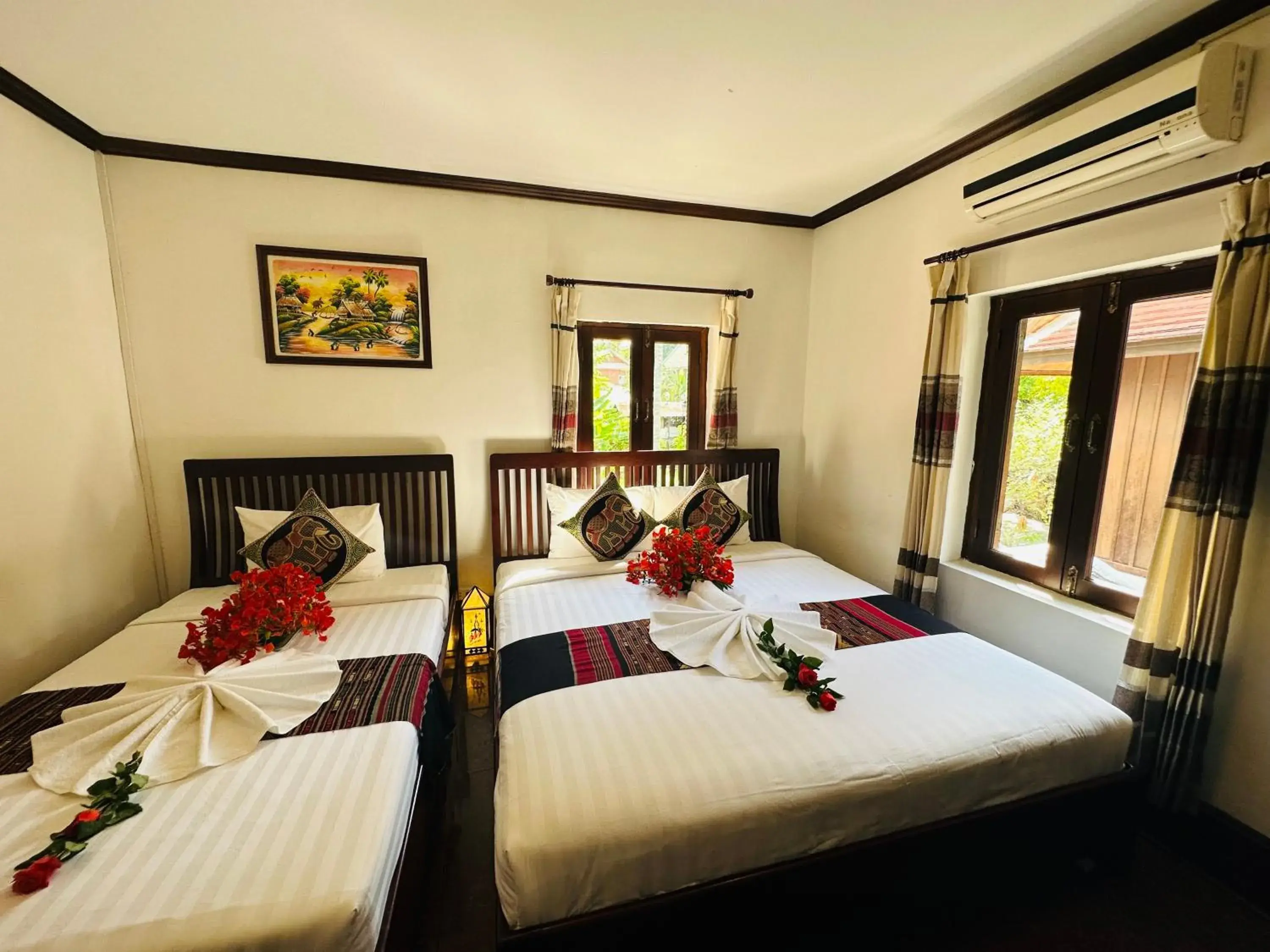 Deluxe Triple Room in Thatsaphone Hotel Deluxe Triple Room in Thatsaphone Hotel