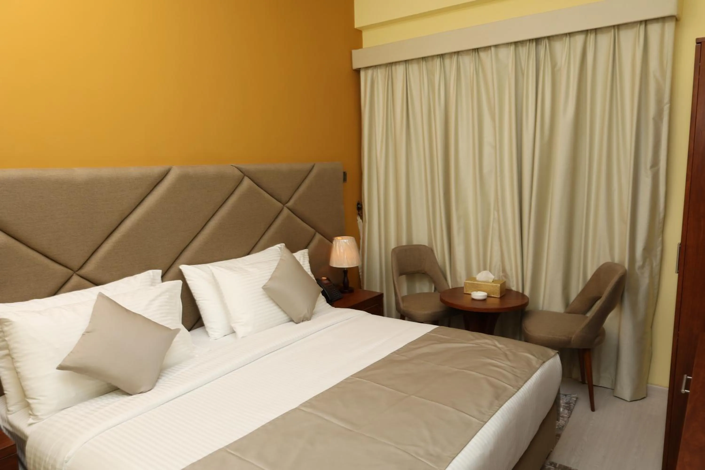 Bed in Grand Marino Hotel