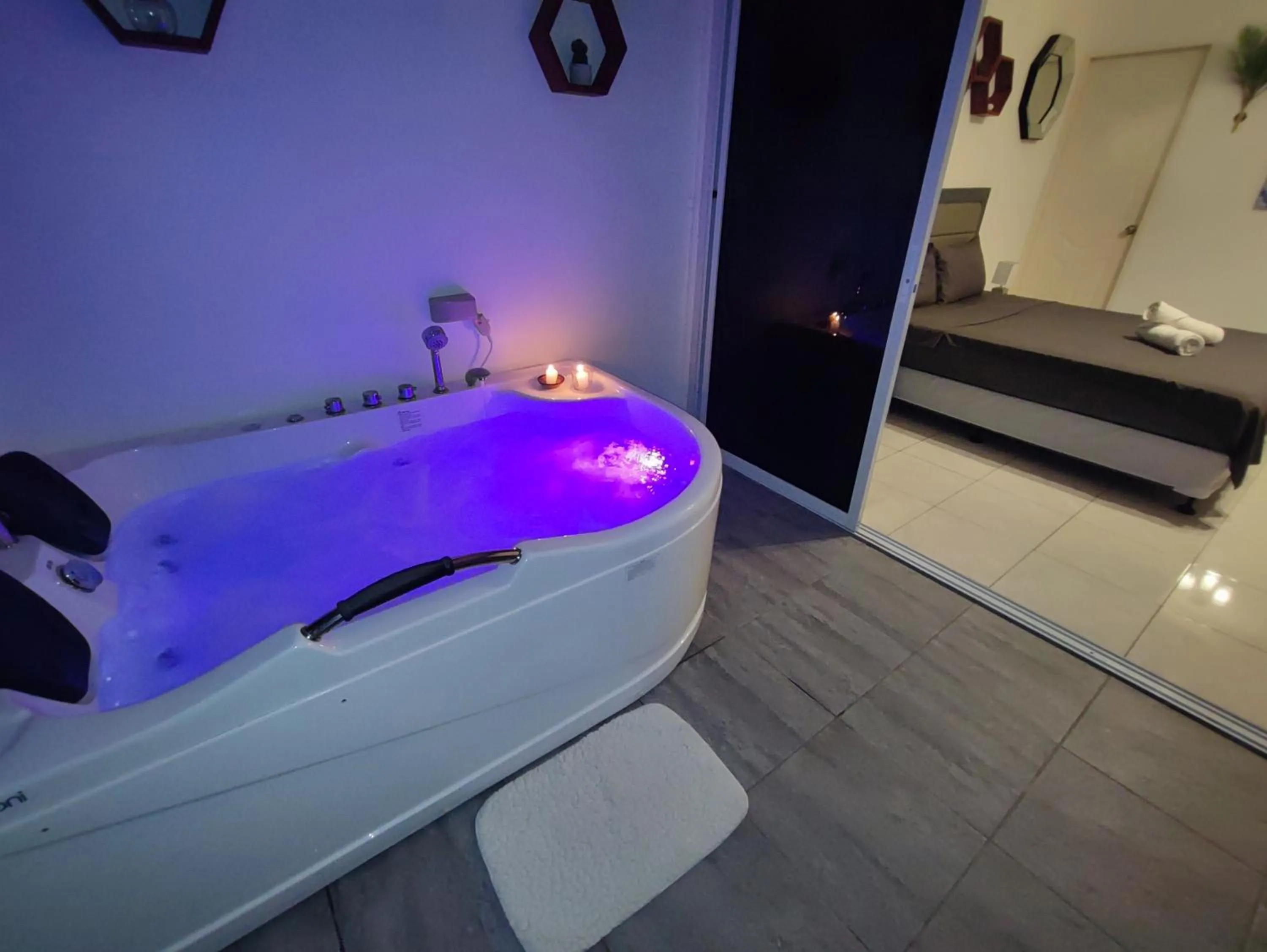 Bed in Bonsai Jacuzzi Suites