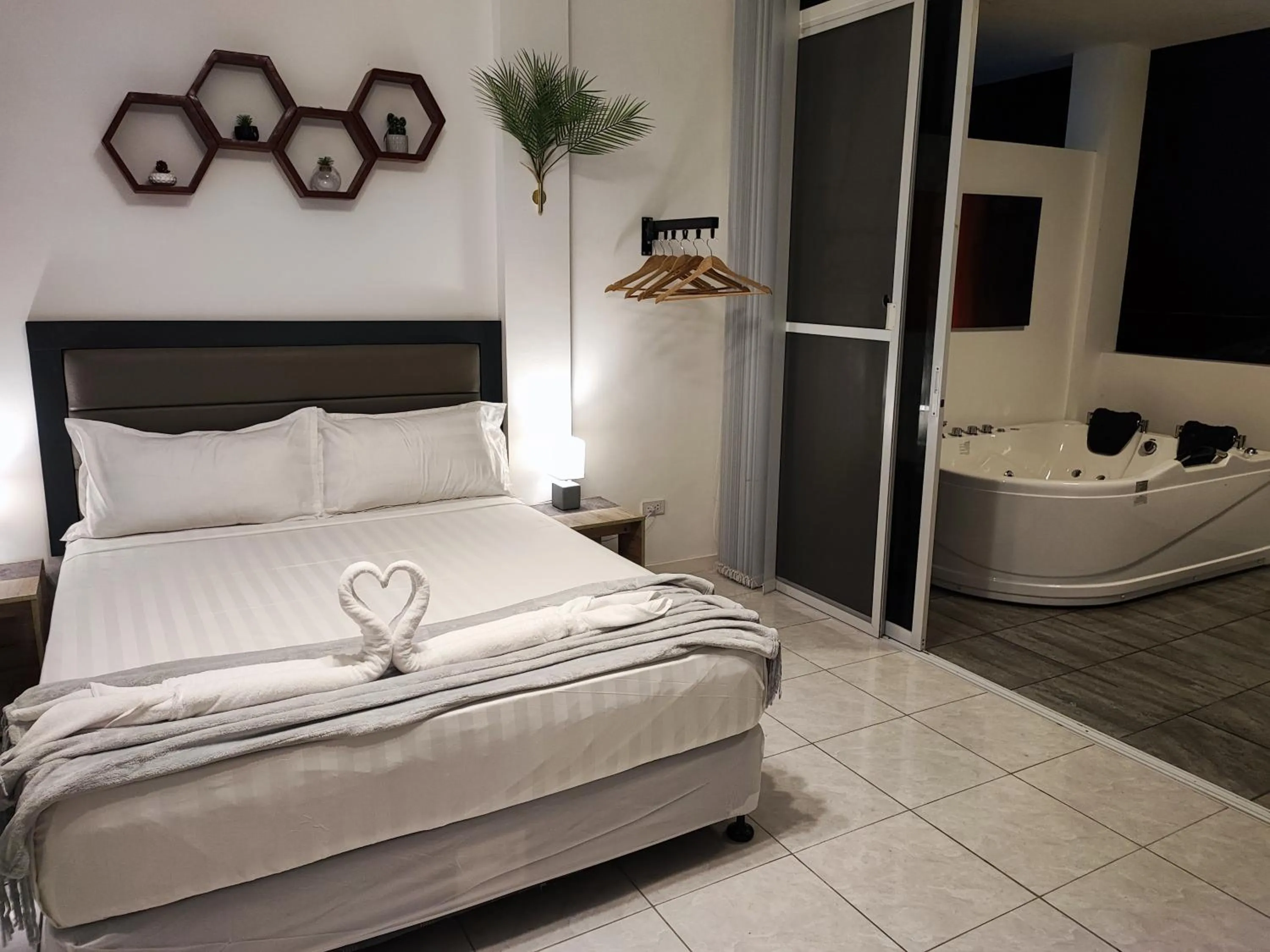 Bed in Bonsai Jacuzzi Suites