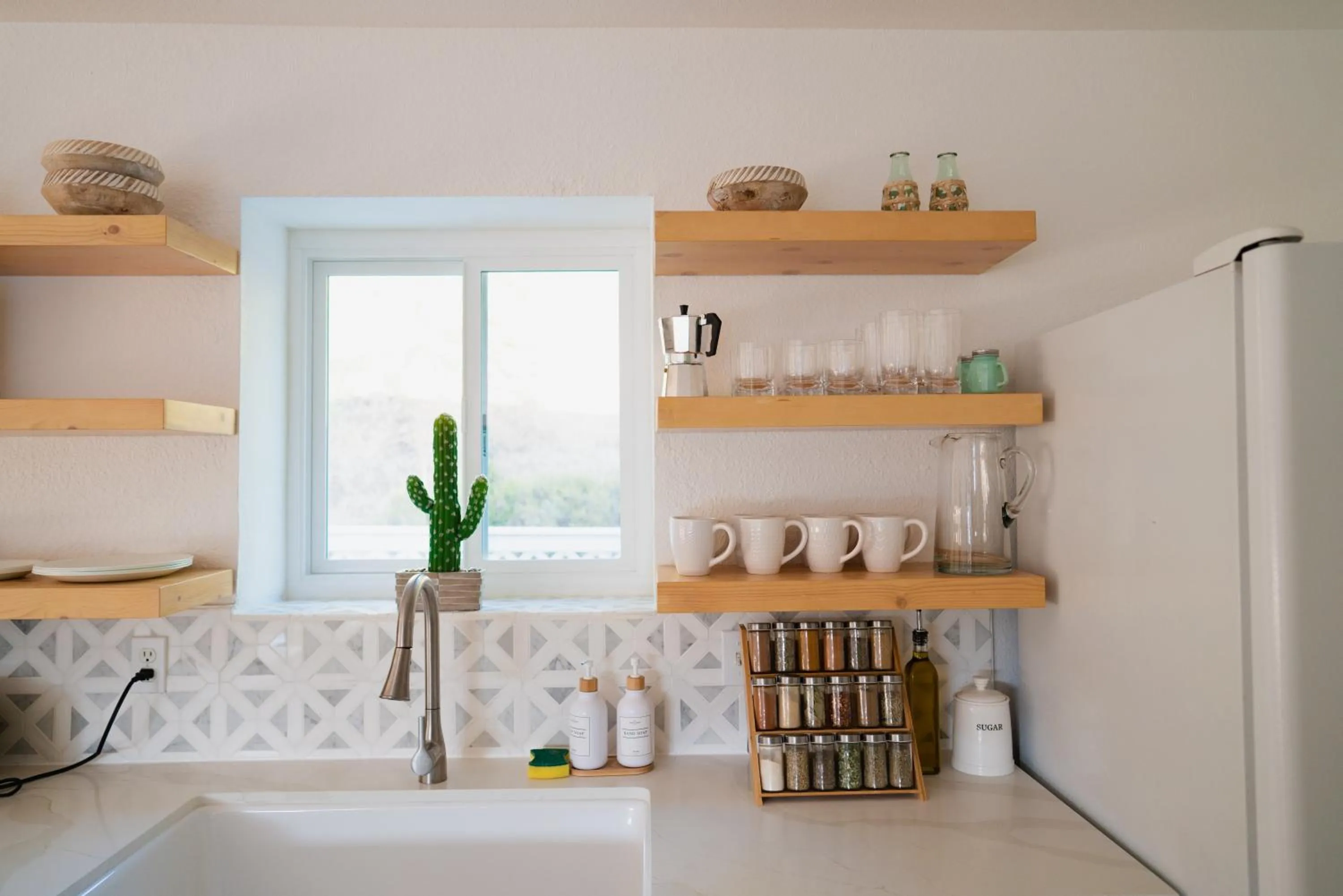 Kitchen or kitchenette in Boho chic oasis by Casa Oso with pool, spa and views