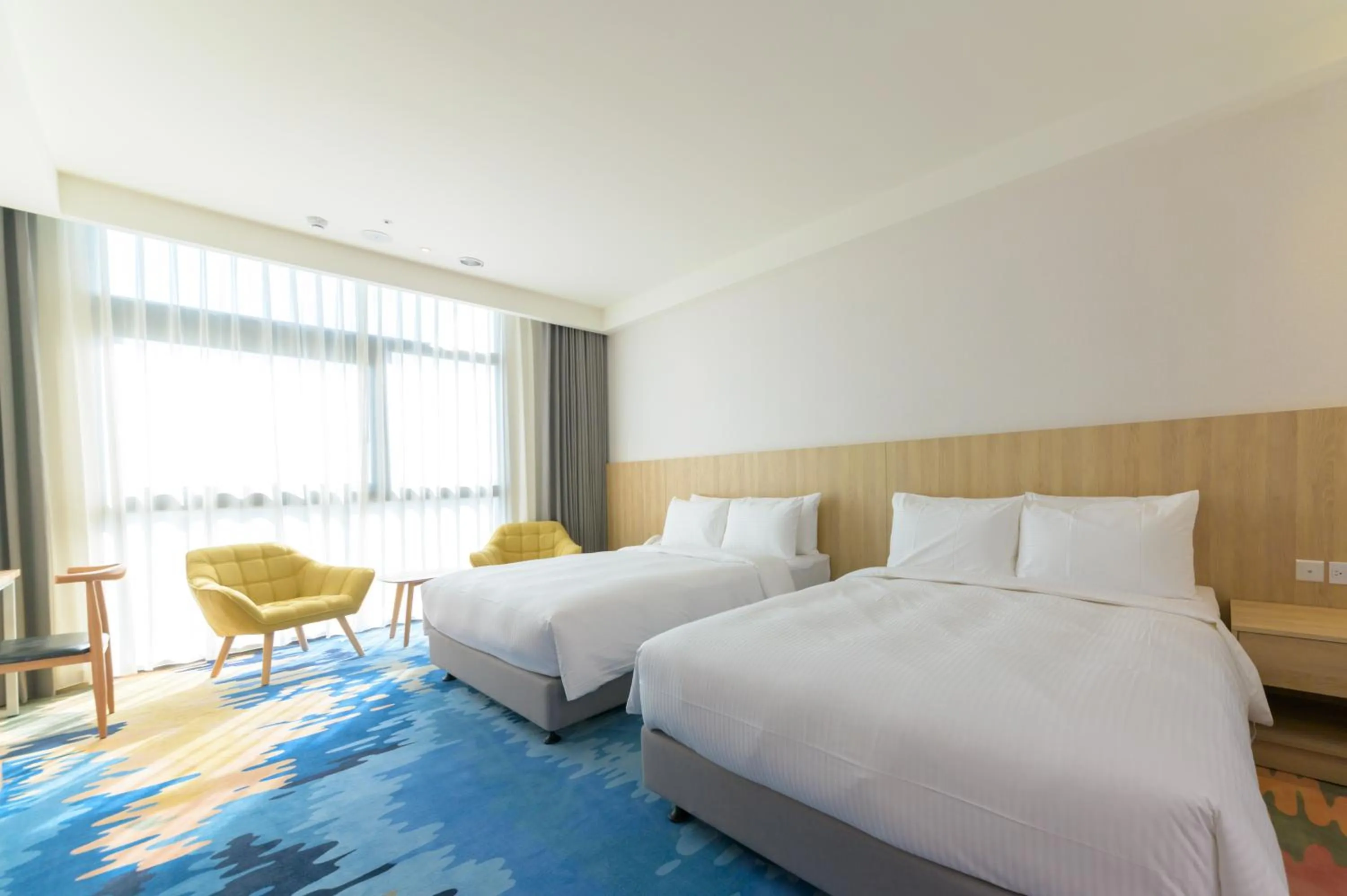 Bed in JANDA Golden Tulip Hotel